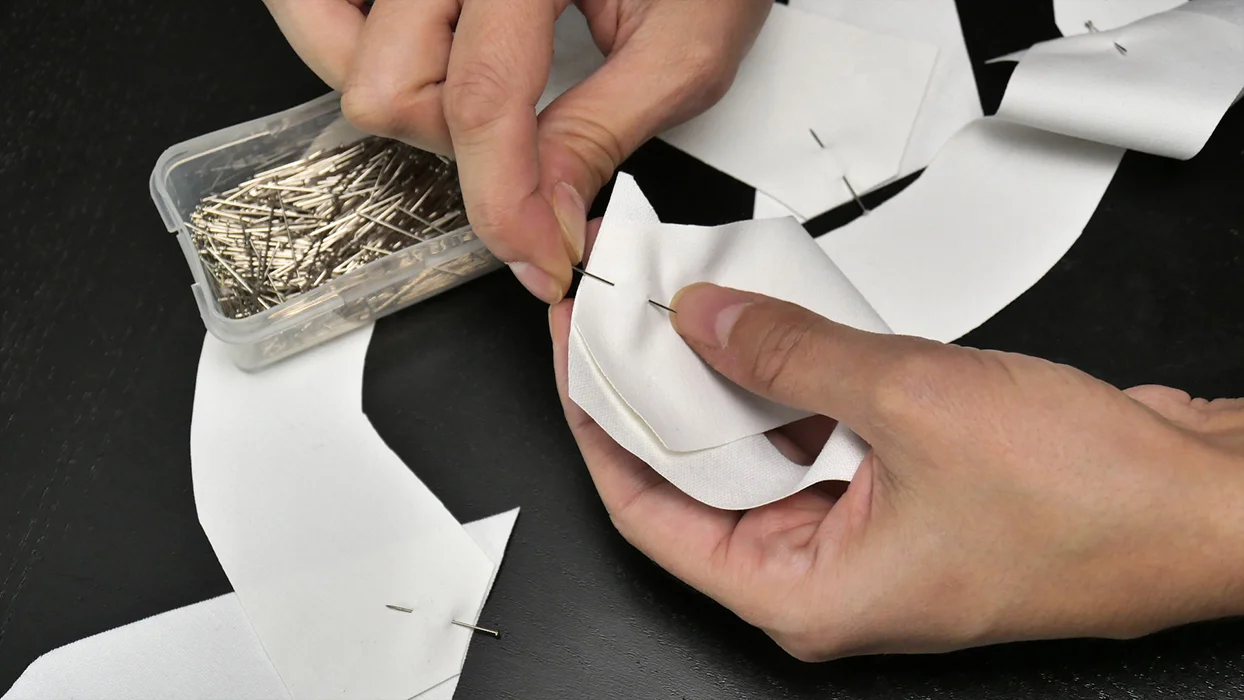Align pieces of your lapel and pin to secure. For best results, use the marks on your paper pattern to help you determine how and where these pieces match up.