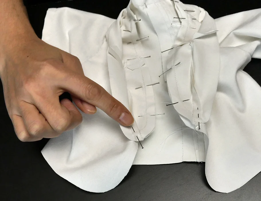Run a seam along the neckline from one end to the other, starting and stopping at the line of stitches inside your lapel.