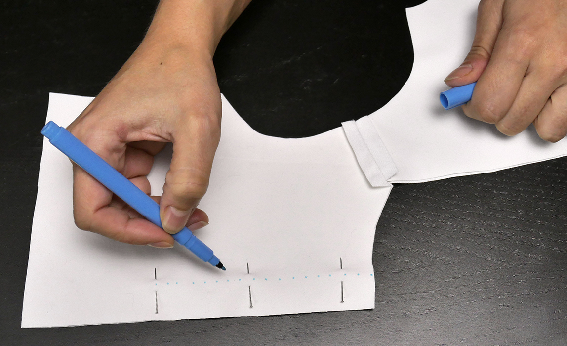 Pin the two "jacket back" pieces together, and mark the desired seam with a fabric marker, or similar tool. My sewing pattern shows you precisely where to make these marks!
