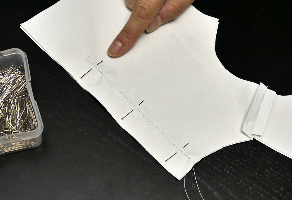 Remember to STOP sewing at the end of your mark, midway down the back, rather than sew to the edge of the fabric.
