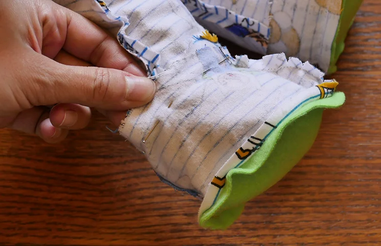 Pin or mark where each pant leg meets each footie.