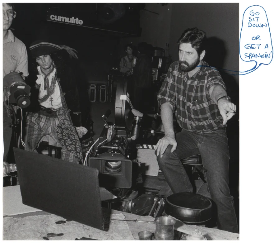 Photo of studio director Michael Caporale. Janet Caporale is visible in the background.