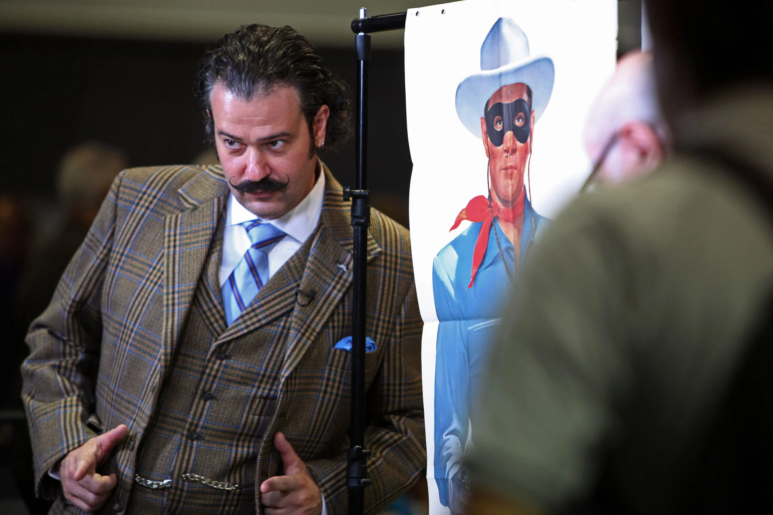 Nicholas Lowry, at left, a vintage poster specialist and appraiser from New York City, poses with a life-sized poster of the Lone Ranger that Tom, of Albuquerque, brought in to be appraised along with a matching poster of Tonto to the Antiques Roadshow at the Albuquerque Convention Center, July 19, 2014, in Albuquerque NM. After the appraisal, Lowry had an impromptu photo session of himself with the posters, including a few selfies. (Morgan Petroski/Journal)