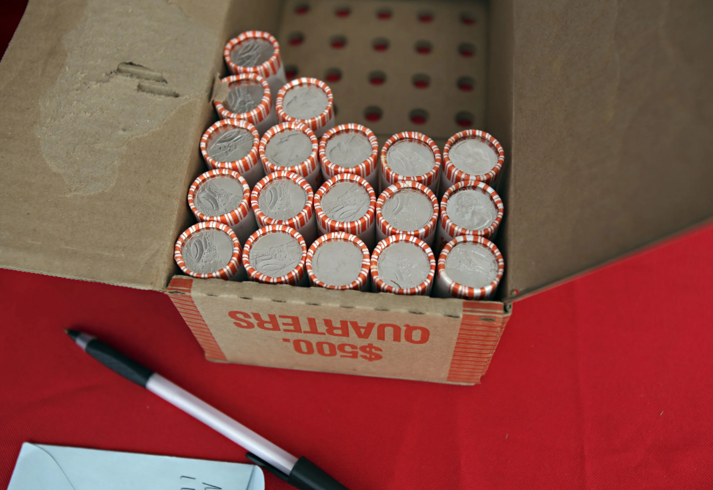 $10 rolls of Chaco Canyon quarters wait to be exchanged by Wells Fargo at the quarter launch at Chaco Canyon, Thursday, April 26, 2012. (Morgan Petroski/Albuquerque Journal)