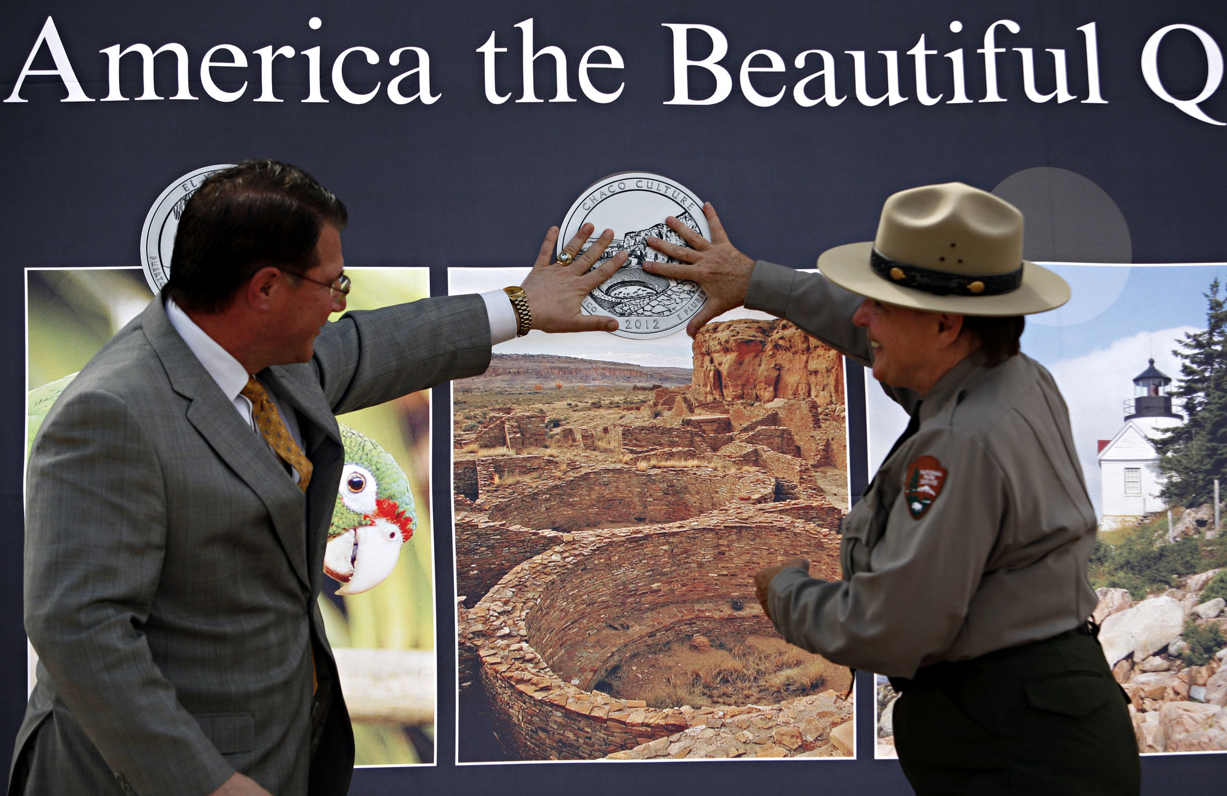  At left, Deputy Director of the United State Mint Richard Peterson and Superintendent of Chaco Culture NHP Barbara West officially launch the Chaco Canyon quarter, Thursday, April 26, 2012. (Morgan Petroski/Albuquerque Journal) 