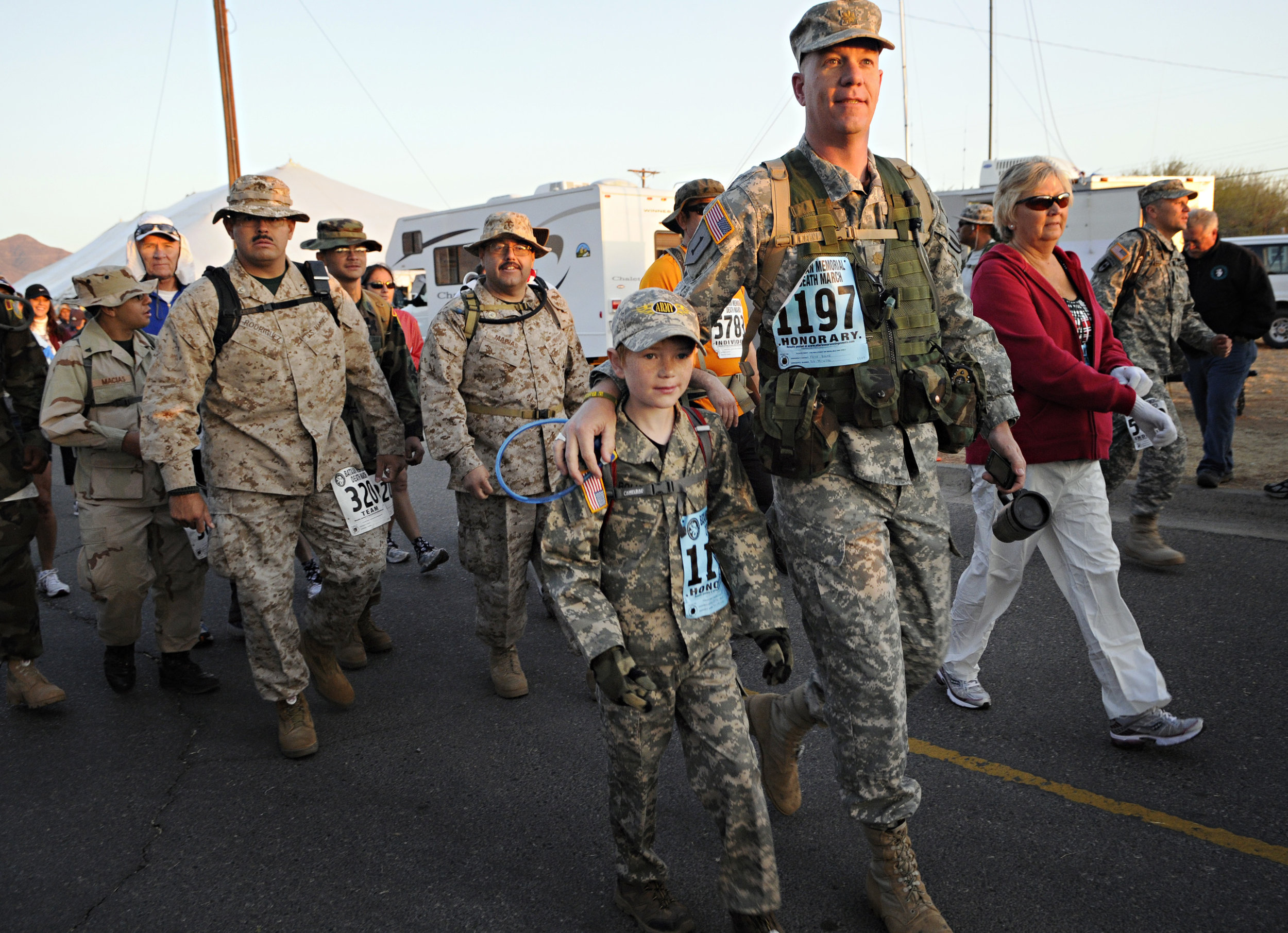  Kein Bolke and his son, Max Bolke, 9, of White Sands, begin their 15.2-mile walk during the 22nd Annual Bataan Memorial Death March at White Sands Missile Range, Sunday, March 27, 2011. This was Max's first Bataan walk and he later said it was good 