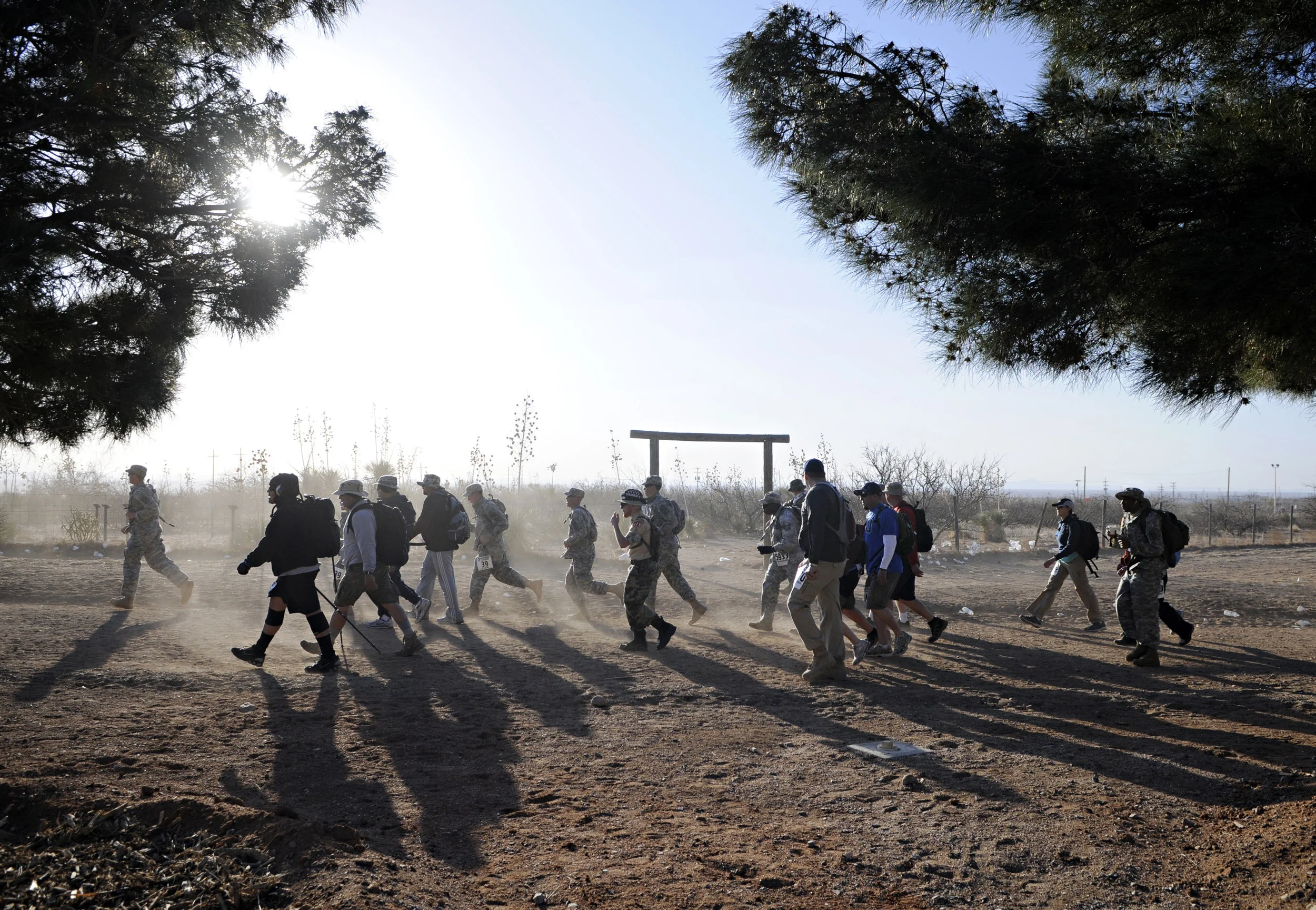 Walkers and runners kick up some dust along with the strong winds that seemed to last all day during the 22nd Annual Bataan Memorial Death March at White Sands Missile Range, Sunday, March 27, 2011. (Morgan Petroski/Albuquerque Journal)