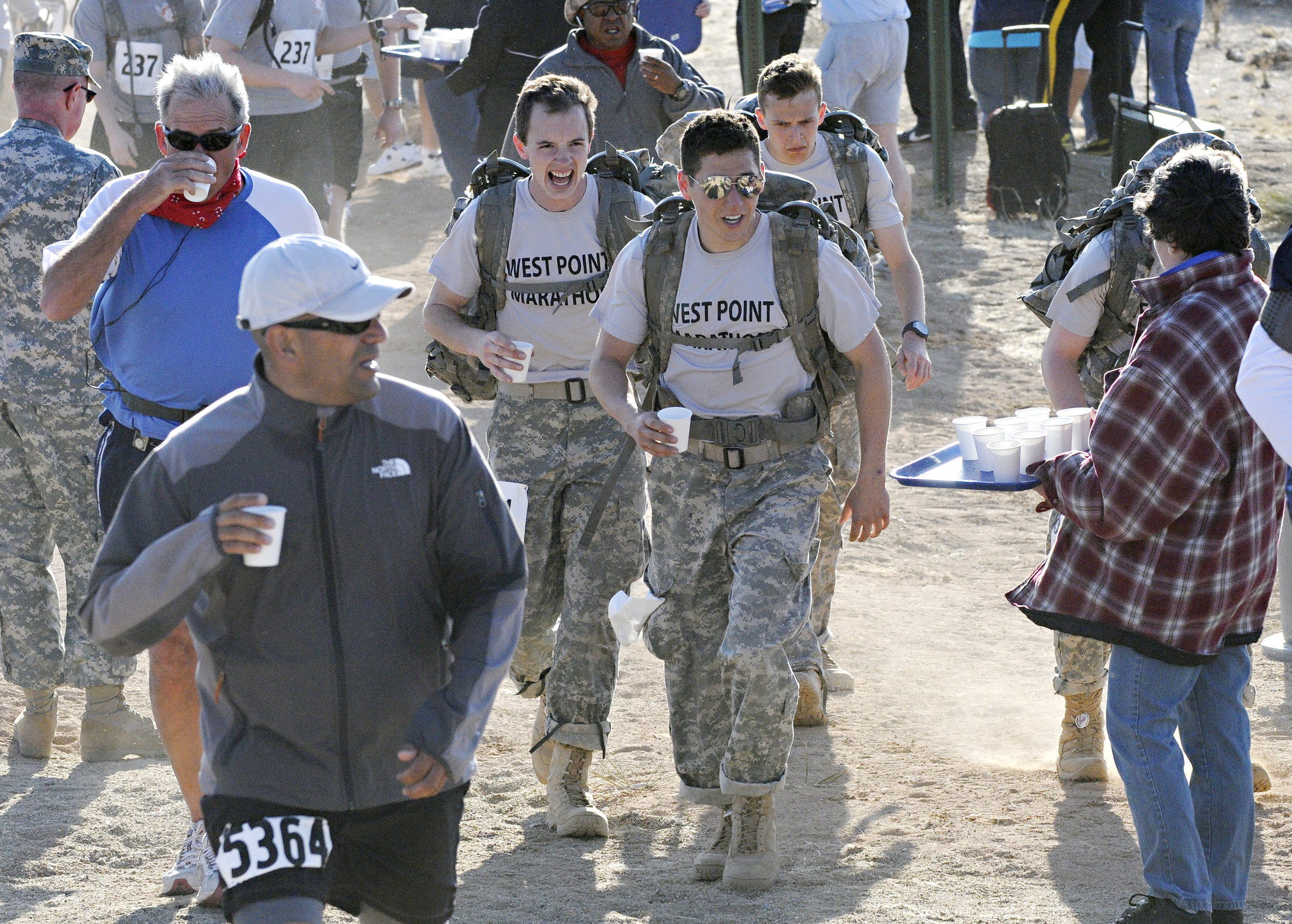 Walk participants hydrate at water point 3 during the 22nd Annual Bataan Memorial Death March at White Sands Missile Range, Sunday, March 27, 2011. (Morgan Petroski/Albuquerque Journal) 