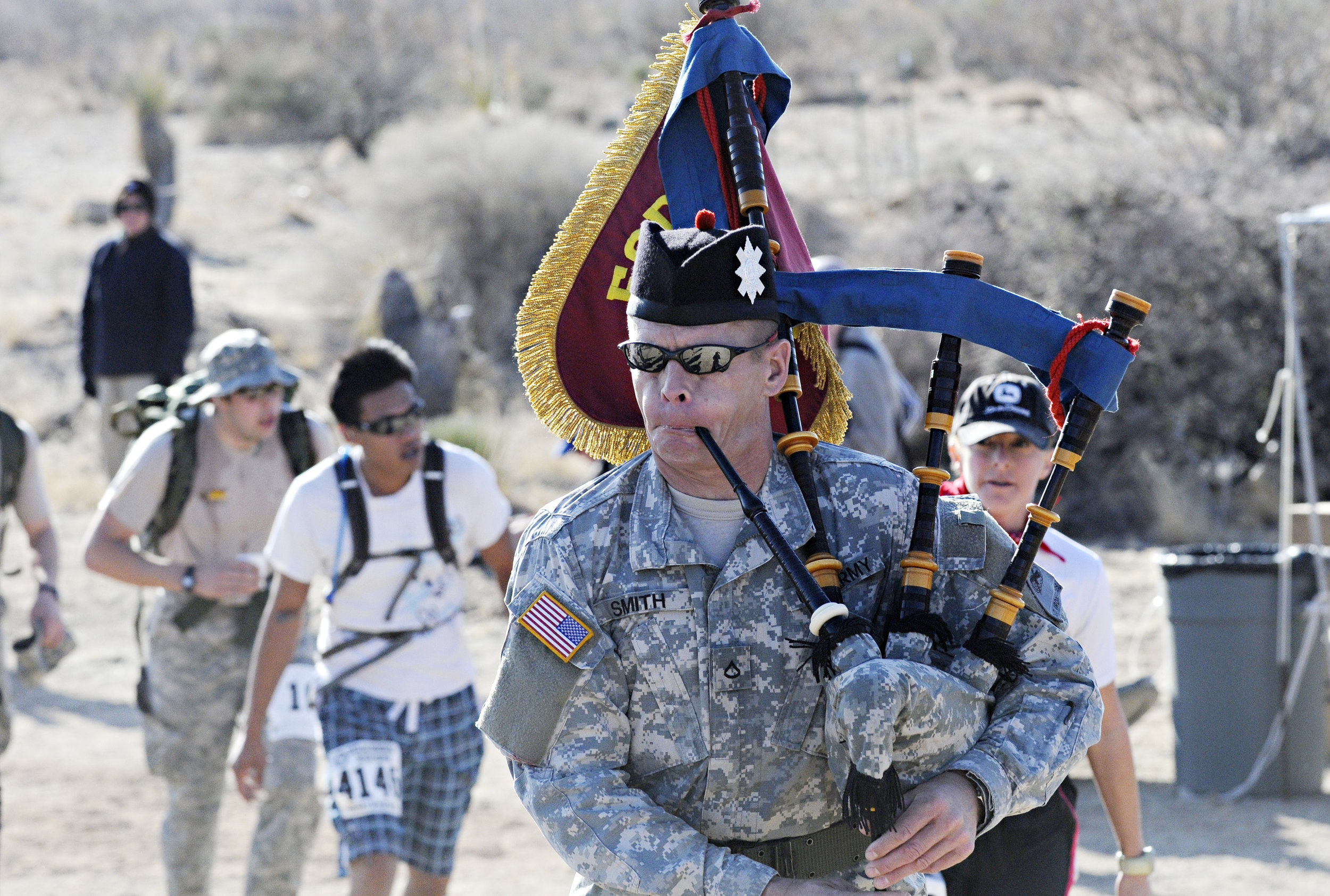  Angus Smith plays the bagpipes while marching in the 22nd Annual Bataan Memorial Death March at White Sands Missile Range, Sunday, March 27, 2011. (Morgan Petroski/Albuquerque Journal) 