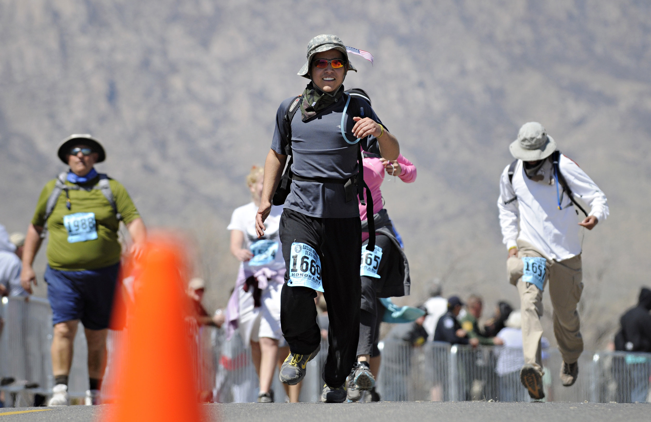  A runner comes down the home stretch of his 15.2-mile run during the 22nd Annual Bataan Memorial Death March at White Sands Missile Range, Sunday, March 27, 2011. (Morgan Petroski/Albuquerque Journal) 