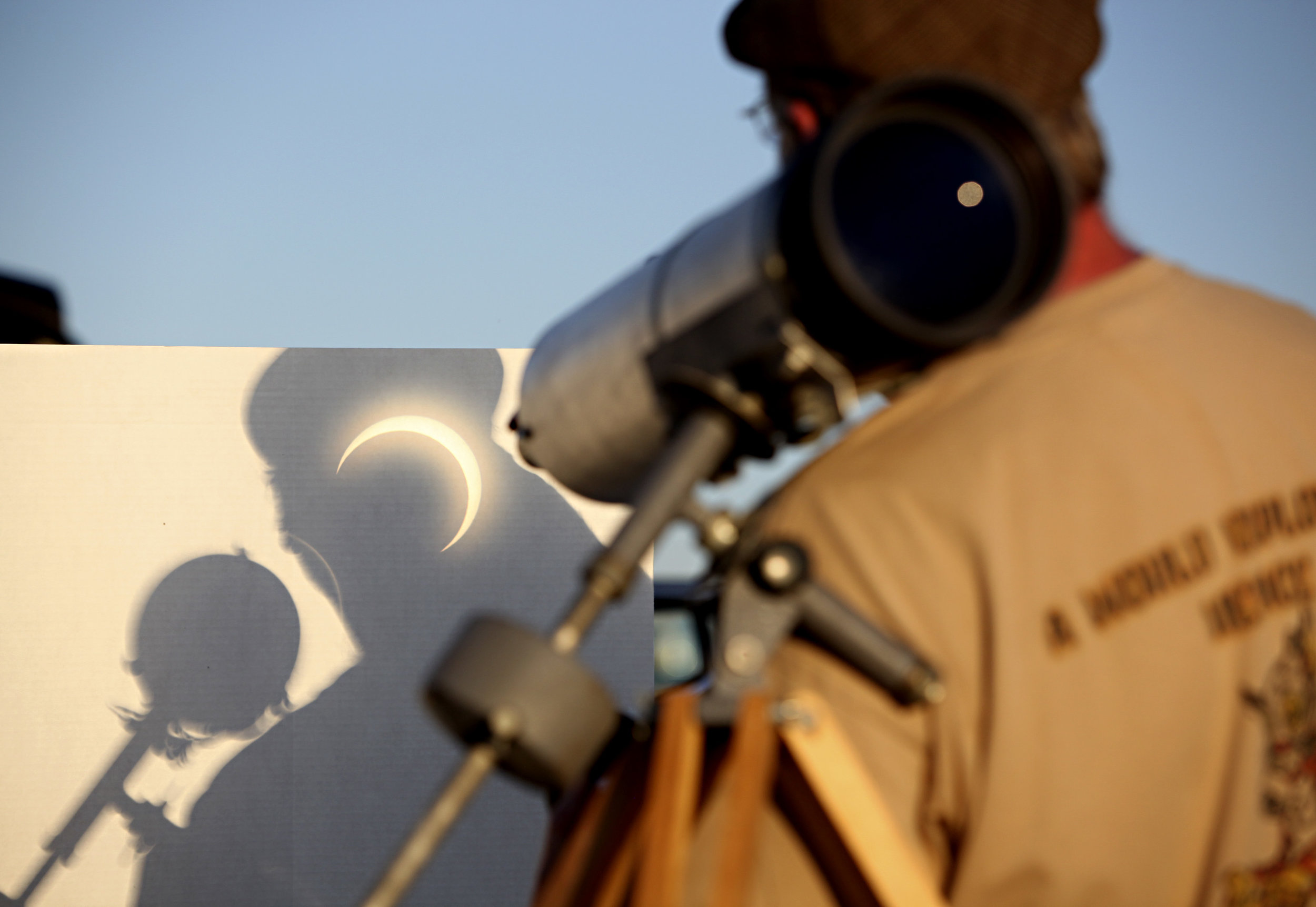 Dave Gallaher, from the University of Colorado in Boulder, CO, watches the annular solar eclipse projected into his shadow during the viewing party near the Hard Rock Casino Presents the Pavilion, Sunday, May 20, 2012, in Albuquerque, NM. (Morgan Pe