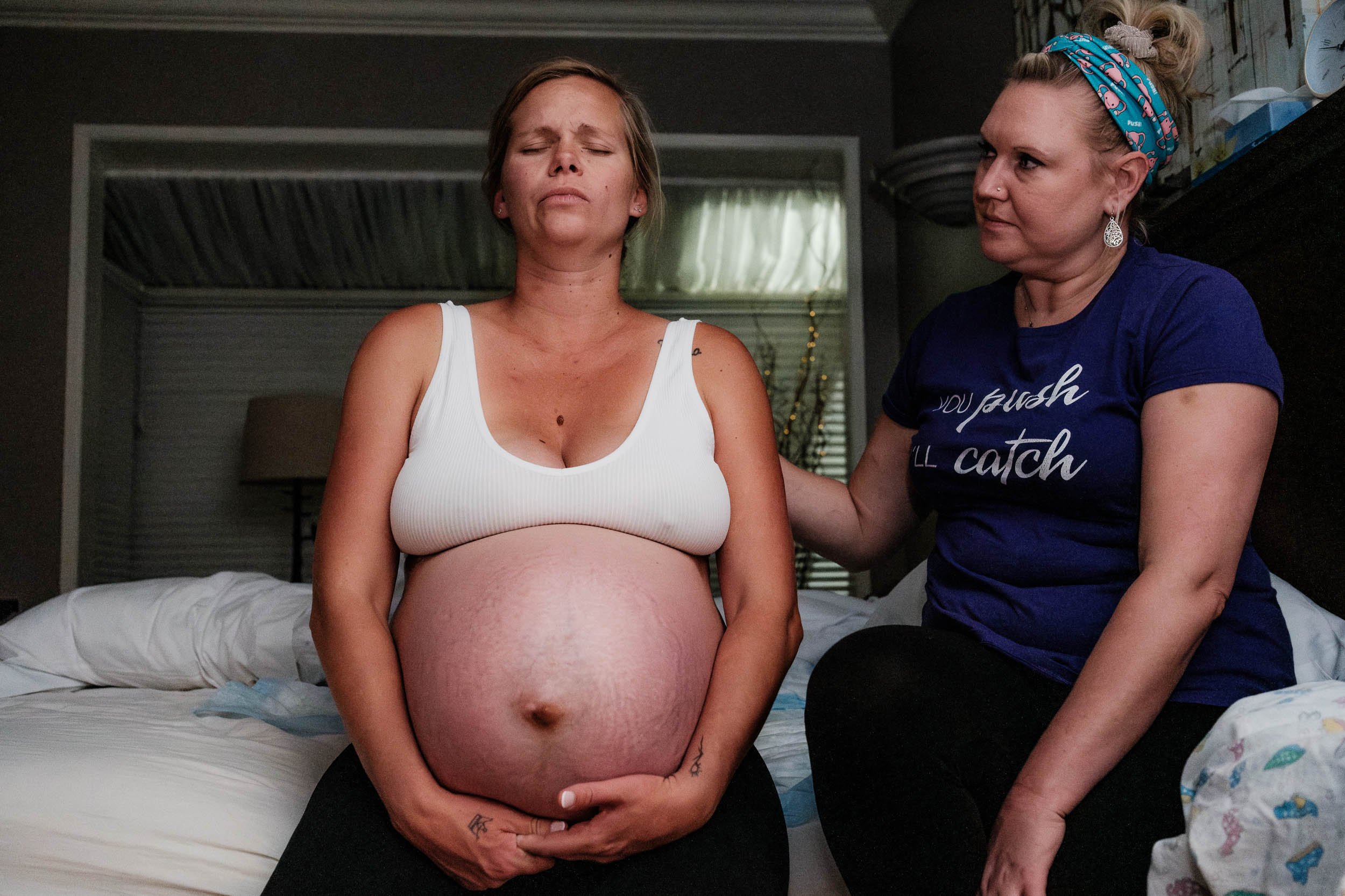 A midwife supports a mother in labor at the Puget Sound Birth Center.