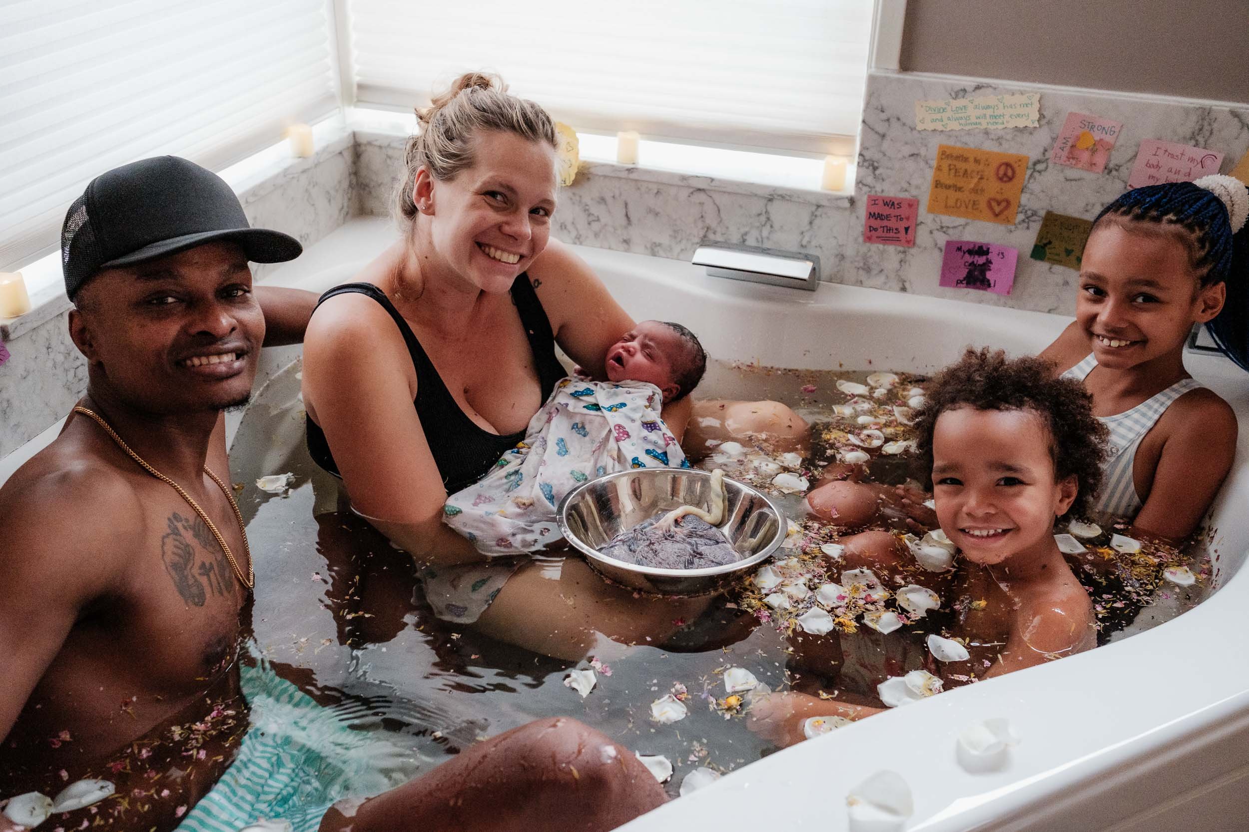 Entire family takes an herbal bath together postpartum at the Puget Sound Birth Center in Kirkland, Wa.