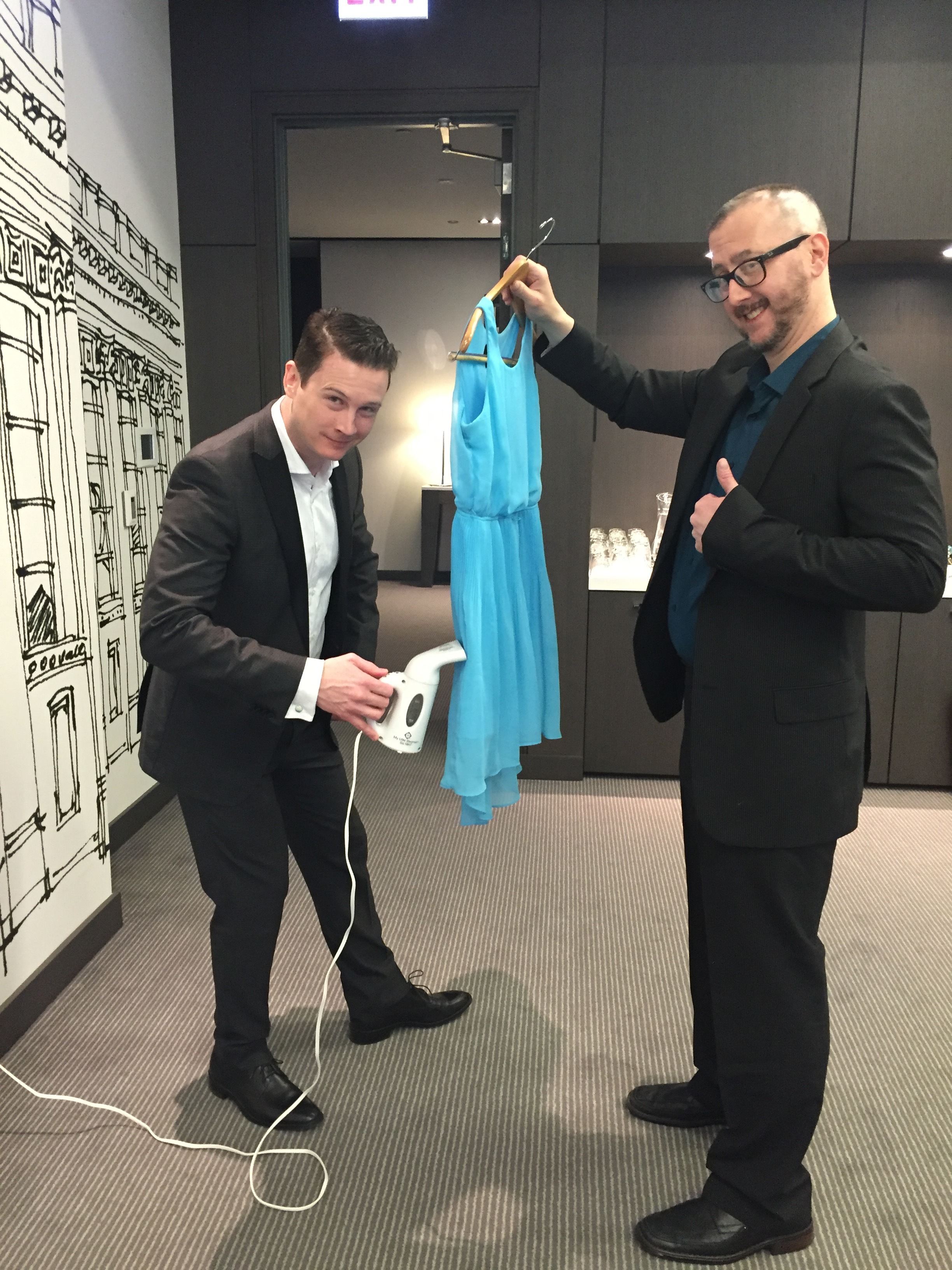 Lawrence and Sean steam costumes before the actors arrive