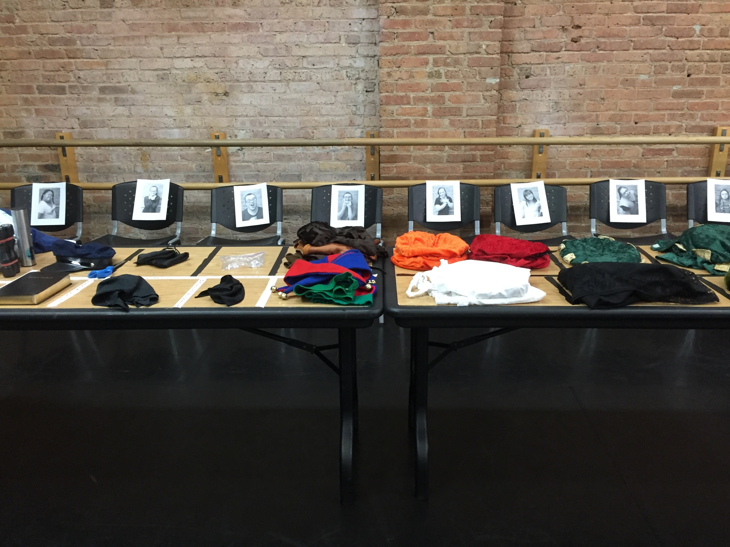 Props, costumes, and chairs set up just like they will be backstage.