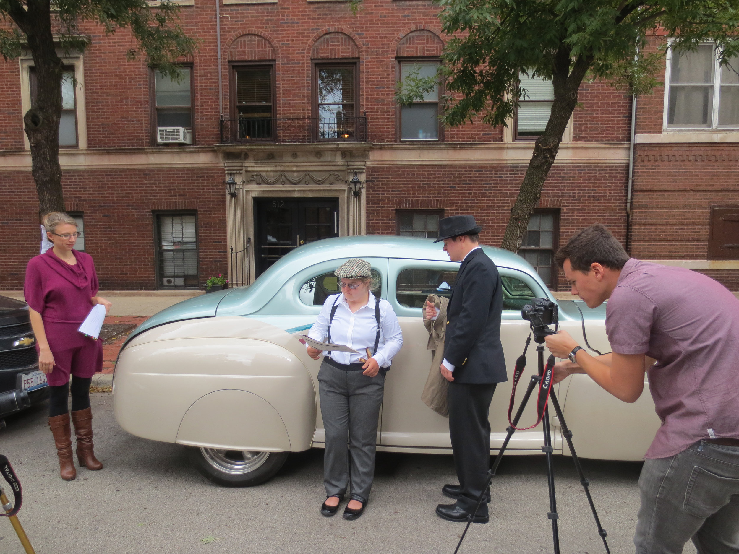  Teaching artist Kendra and actors Kathleen and Andrew wait for cameras to be set for a scene 