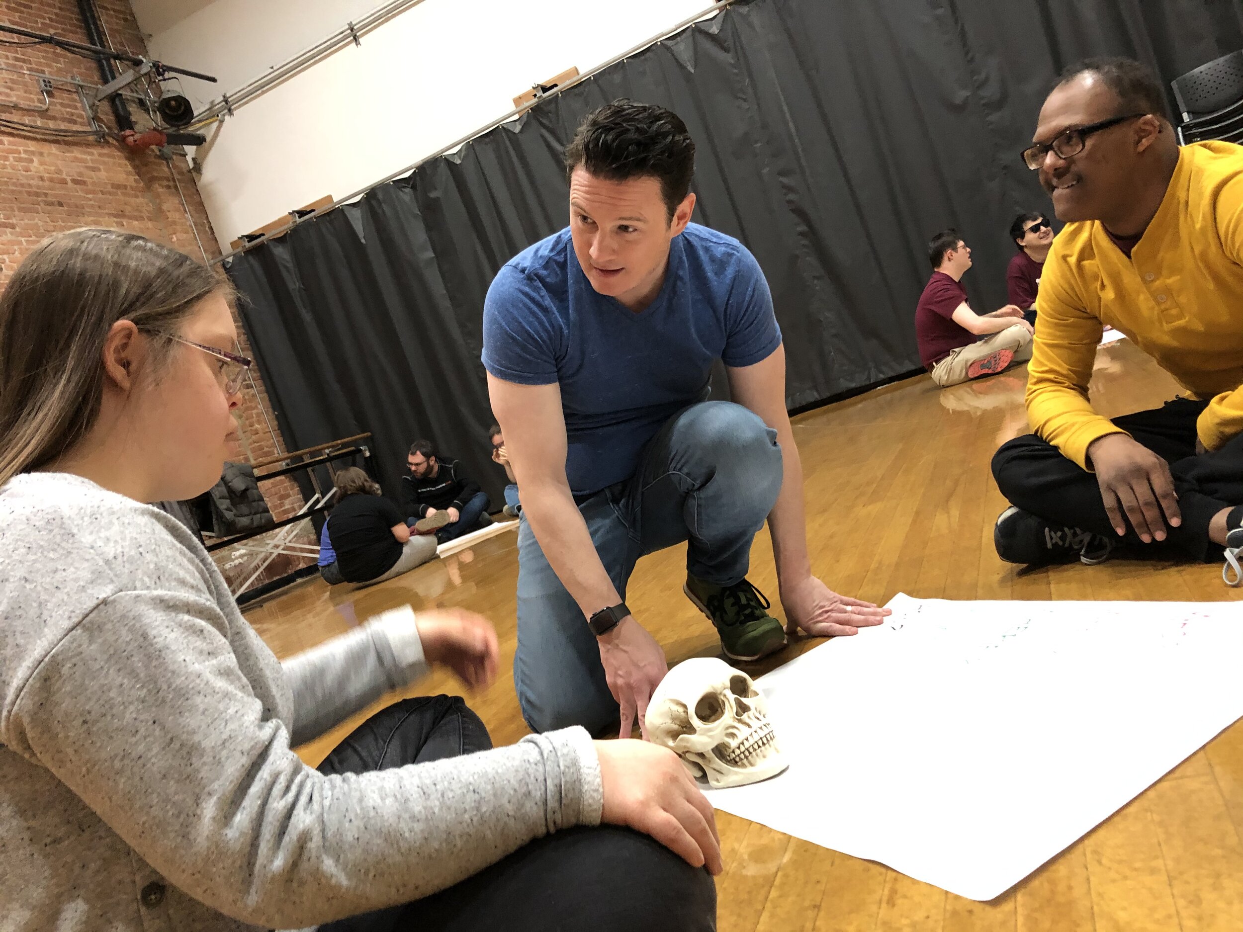 Lawrence discusses the story of the skull with Emily and Ben