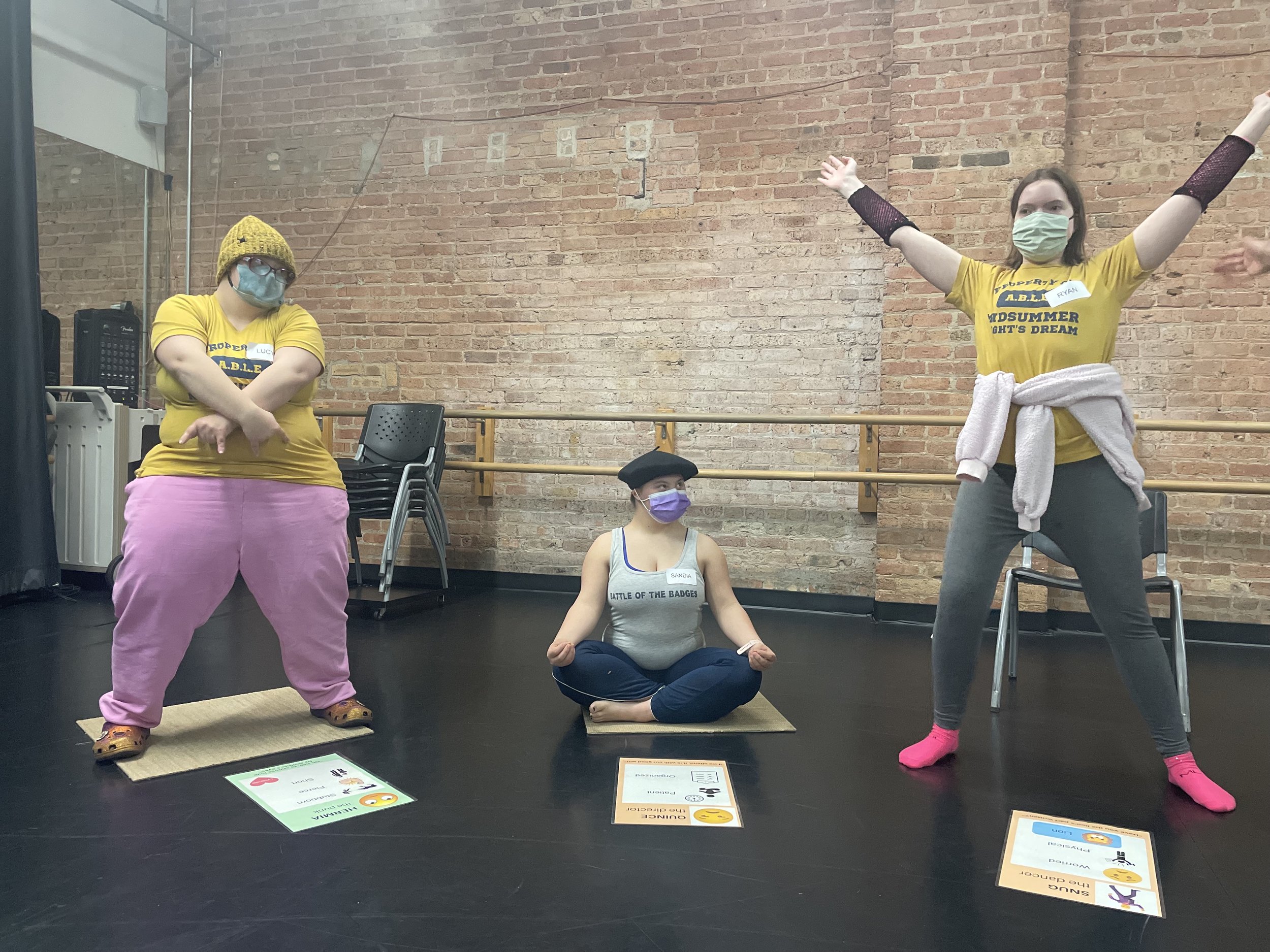  Throughout the process, actors had the chance to try several different characters to see which resonated with them the most. Here, actors Lucy Walsh, Sandia Coleman, and Ryan Foley come up with signature poses for different characters in a rehearsal