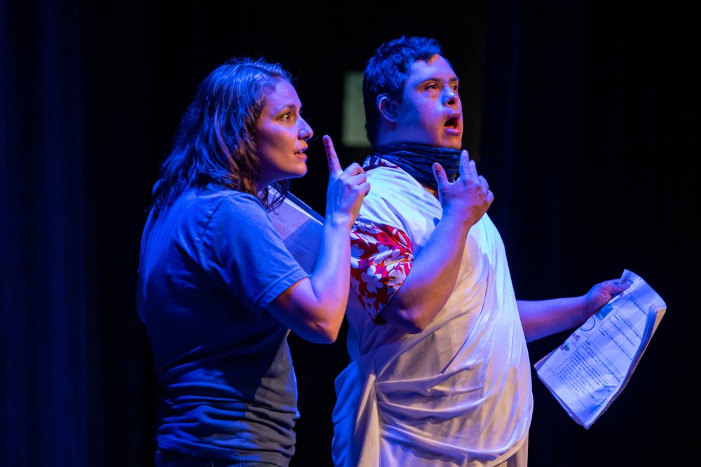  Peter and Executive Artistic Director Katie Yohe perform as Flute/Thisbe in the play within a play in A Midsummer Night’s Dream. They both do the sign for “speak” as they perform the line “  O Pyramus, arise! Speak, speak.”   