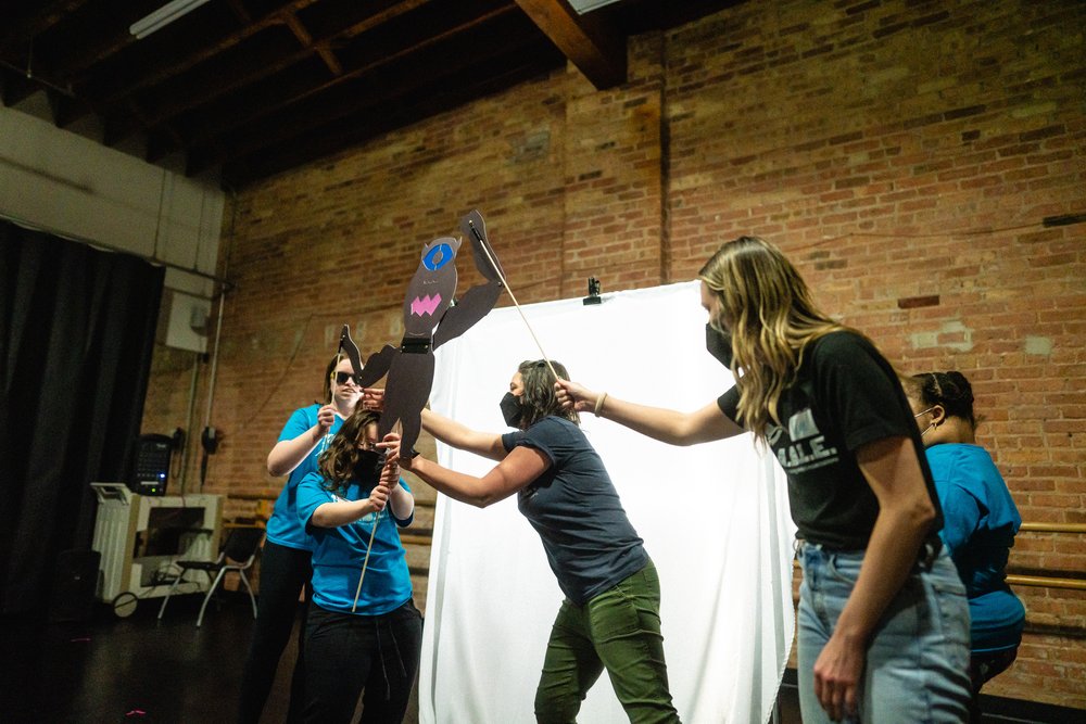  Co-director Katie Yohe introduces a jointed Cyclops shadow puppet to members of the ensemble.  The Odyssey  will feature shadow puppet monsters and settings with consultation from Manual Cinema company member, Kara Davidson. -  Photo by Joe Mazza/Br