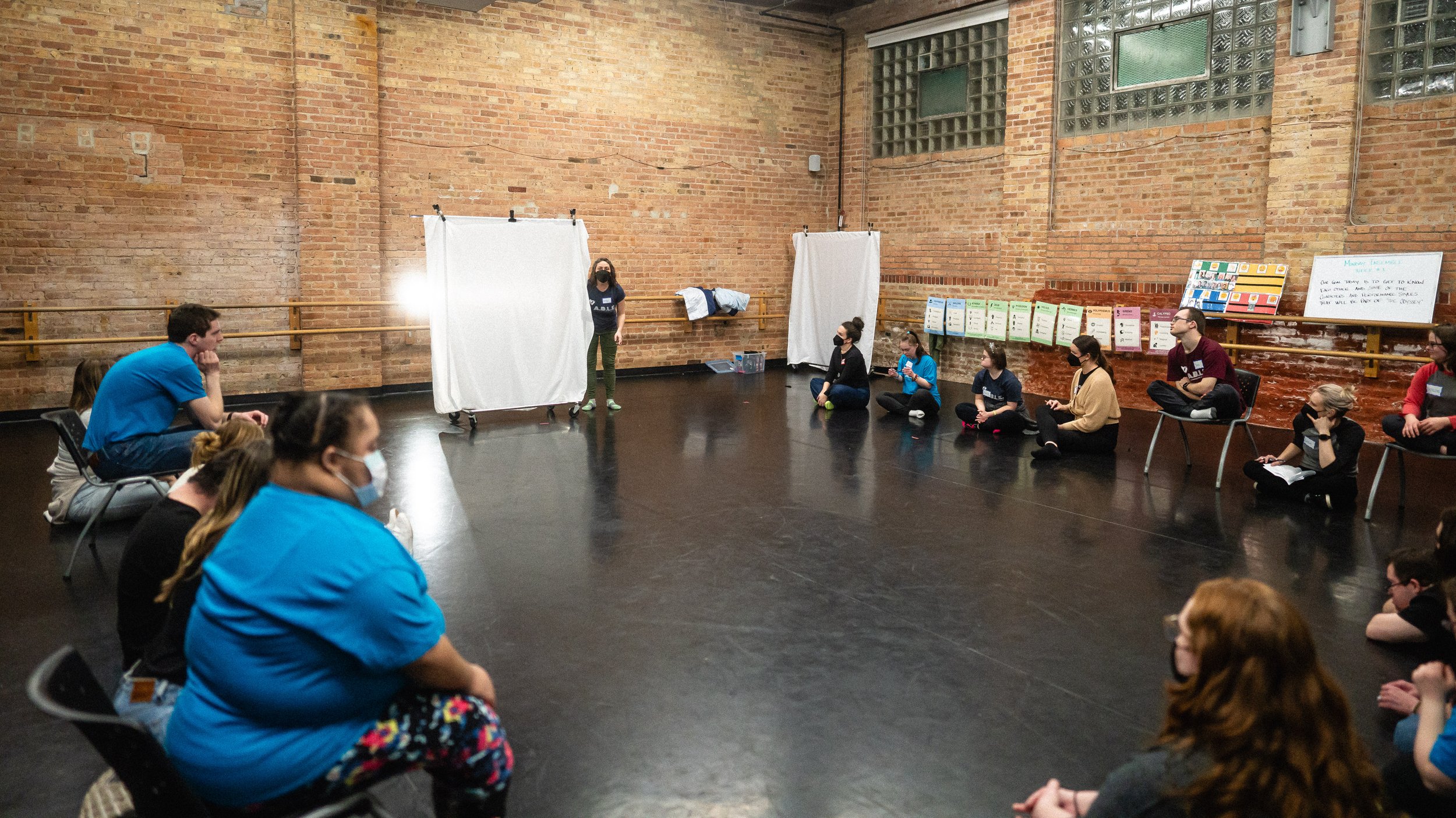  Ensemble members gather to rehearse a shadow puppet segment -  photo by Joe Mazza/Brave Lux  