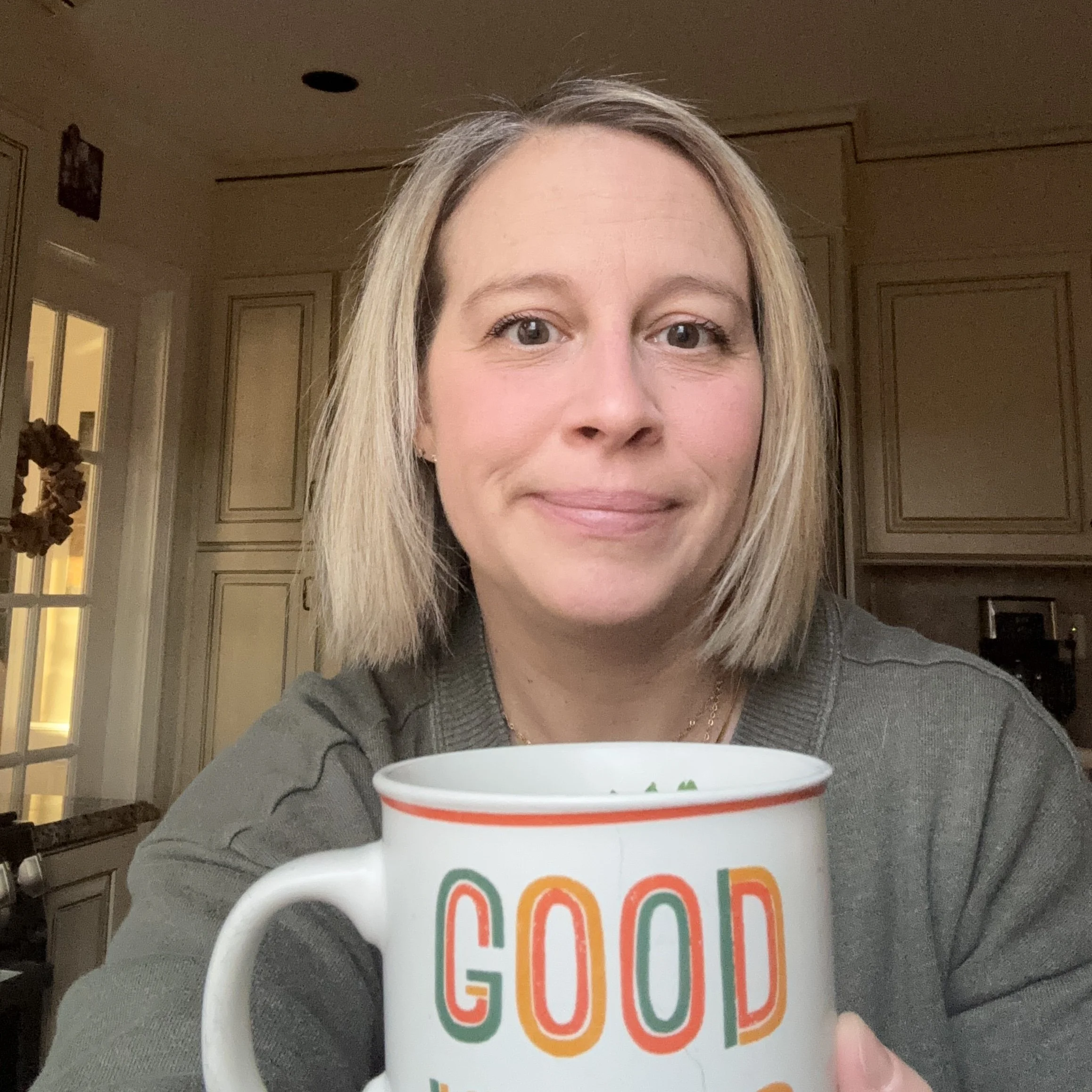 Our founder, Dr. Janis Covey , holding a mug of our natural allergy relief tea