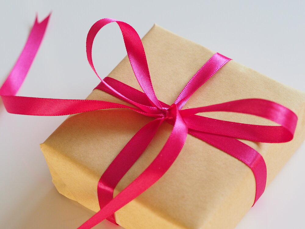 Package with pink bow.