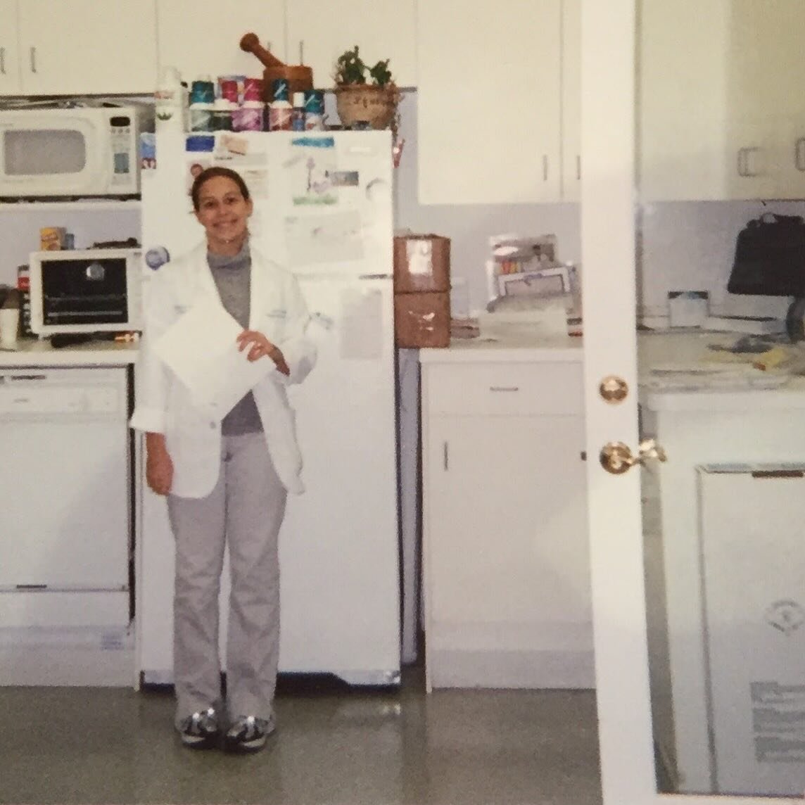 Have you ever wondered who created your favorite Kosmatology products? Look no further than me, Janis - the founder and owner.  As you can see in the old picture above, this was from when I first started working as a compounding pharmacist, formulati