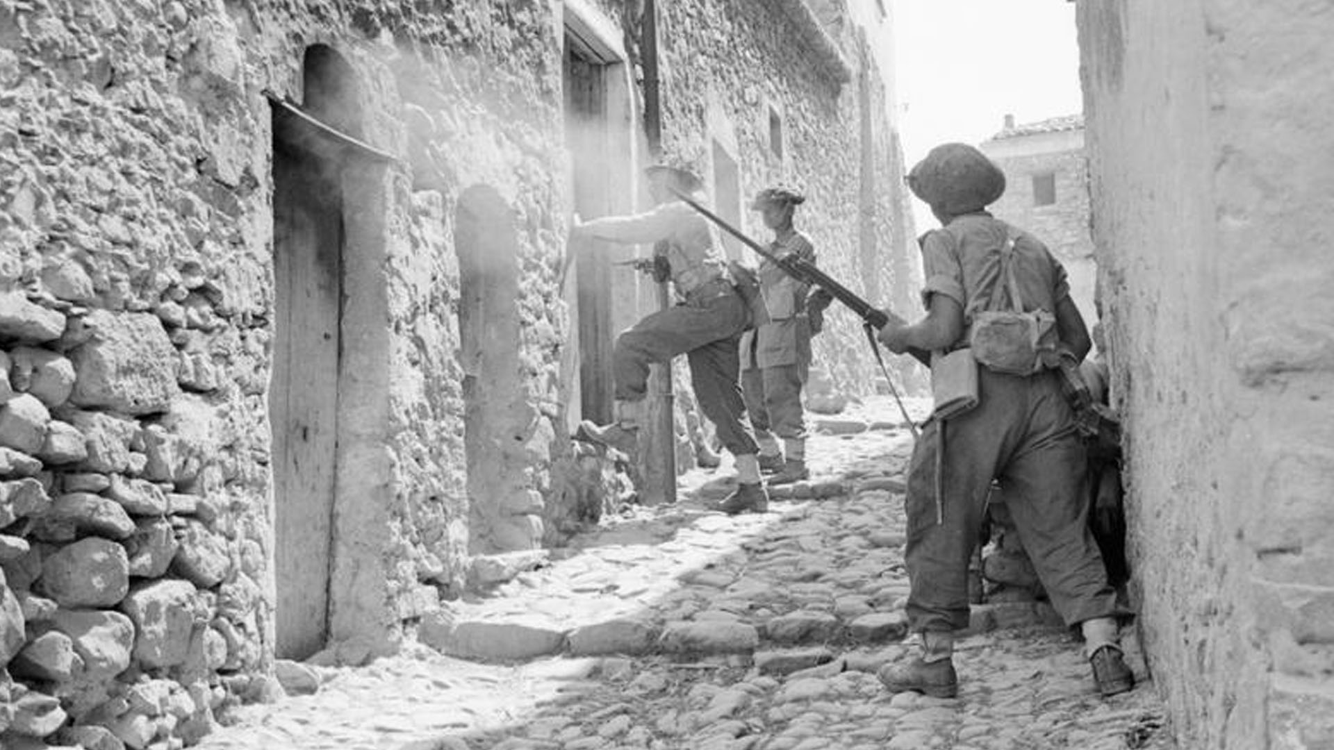 Imperial War Museum Photo: NA 5388 (Part of the War Office Second World War Official Collection). Men of the 6th Battalion, Royal Inniskilling Fusiliers, 38th Irish Brigade, searching houses during mopping up operations in Centuripe, Sicily in August 1943. Photo taken by Captain Richard Felix Gade - No 2 Army Film and Photographic Unit.