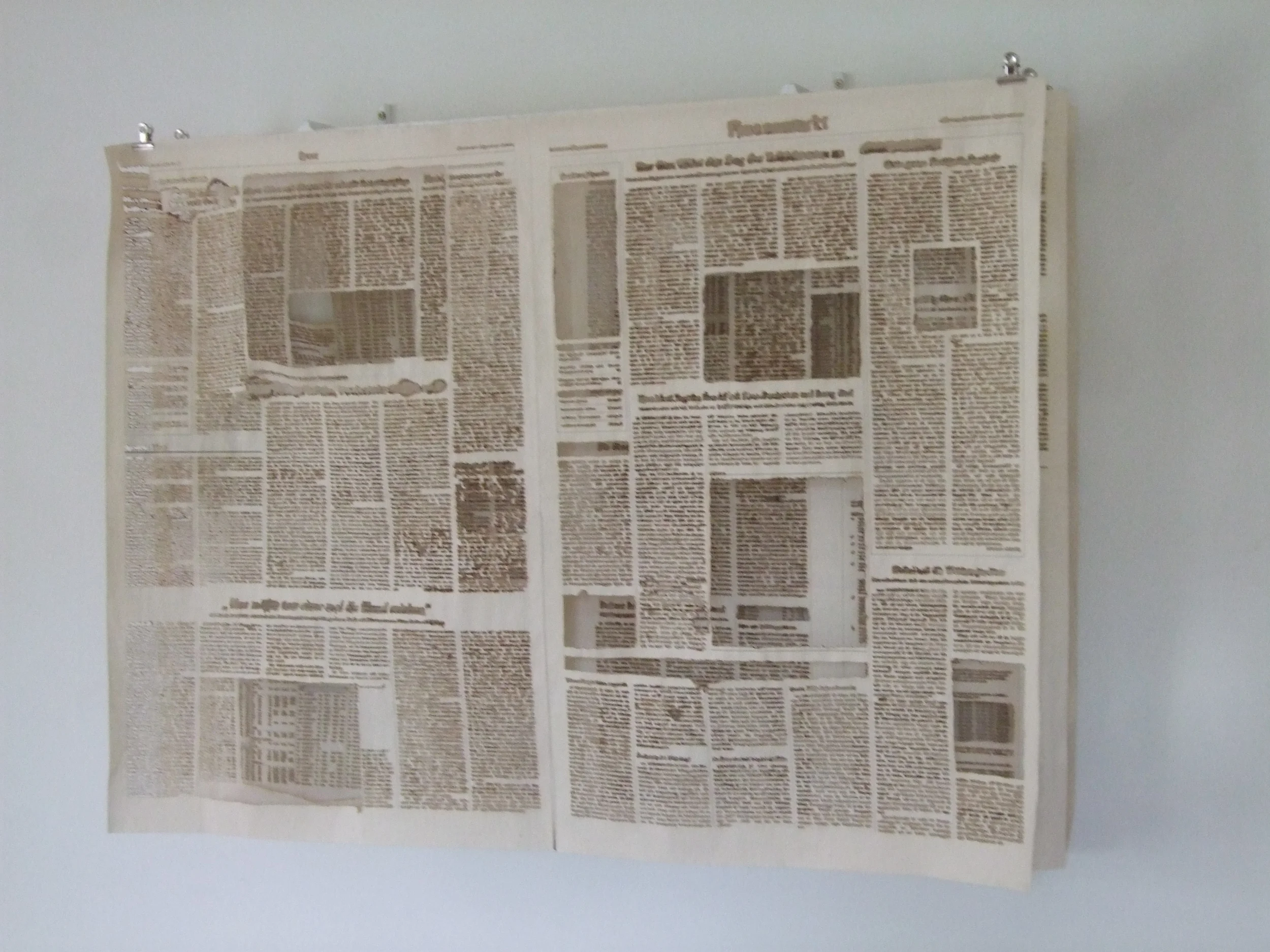 News. 70 + 80 + 30cm. Newspaper, clamps, metal. GalleriK.