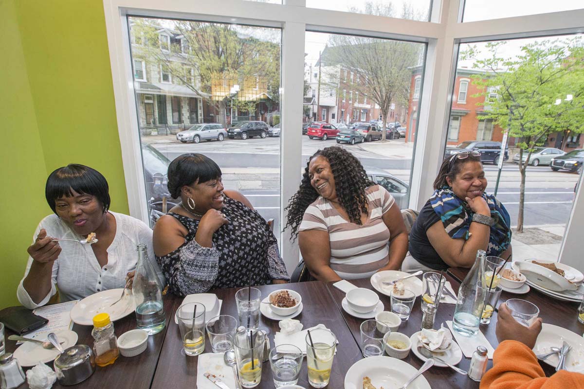 EAT customers enjoying a Pay What You Can meal