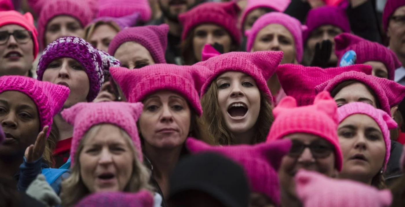 A group of protestors sporting “pussyhats”