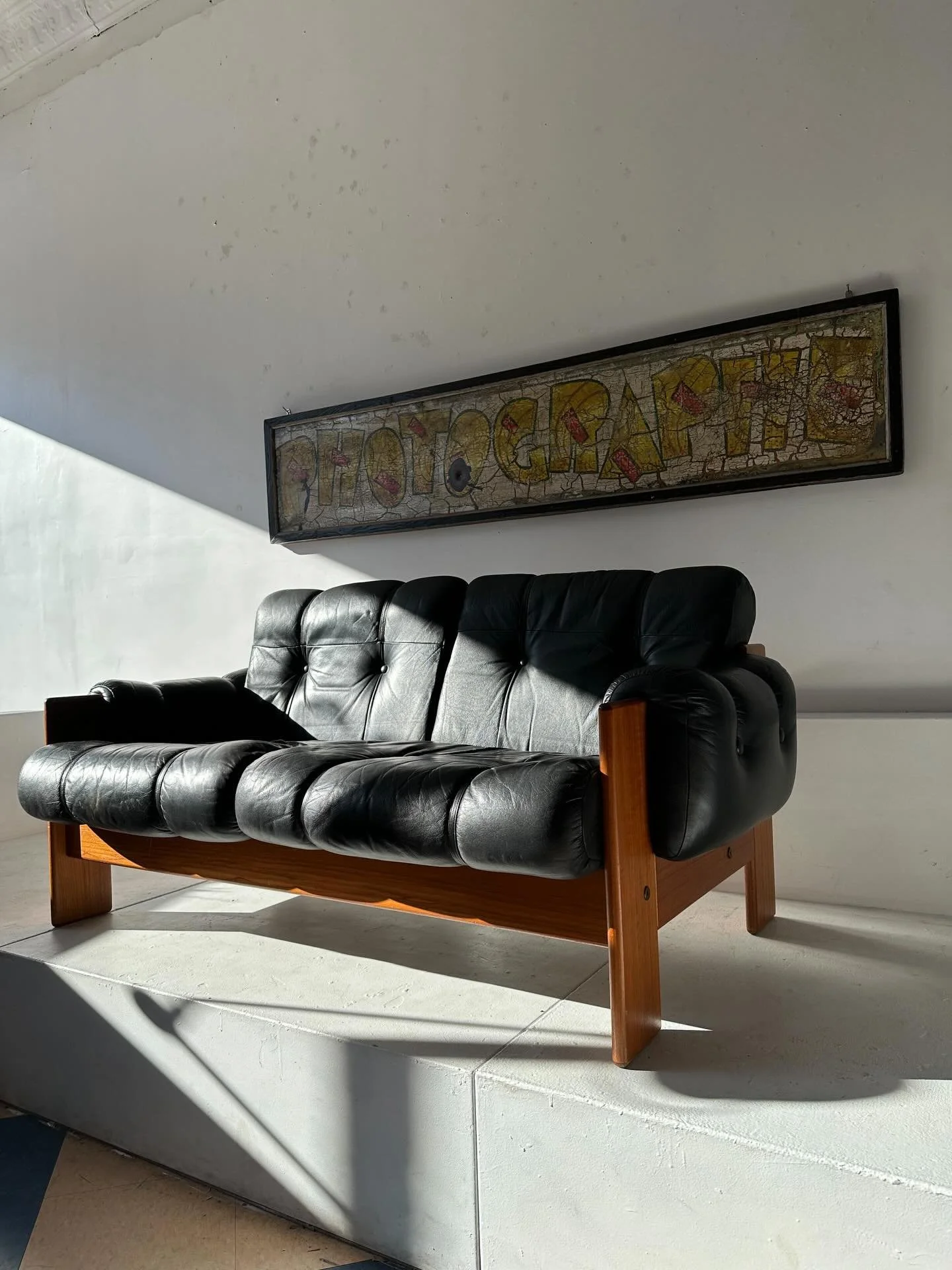 Very stylish midcentury Finnish two seat leather and teak sofa.  We have two matching chairs that we will post tomorrow, but purchaser of sofa will have first crack.  Very comfortable and properly sprung.  60&rdquo; wide.  16&rdquo; seat height.  One