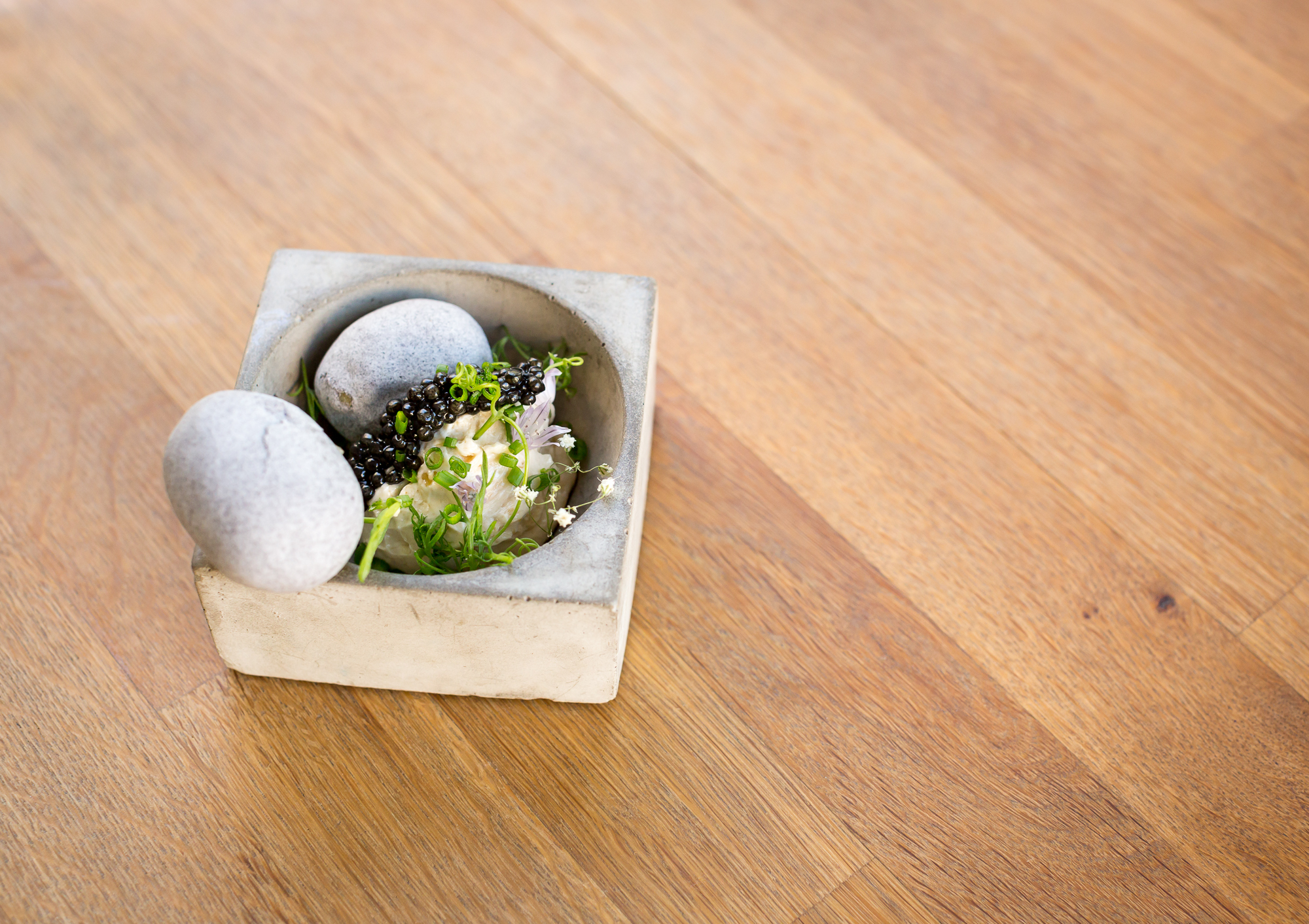 sturgeon caviar fermented new potato/cured lemon/chamomile/living pea