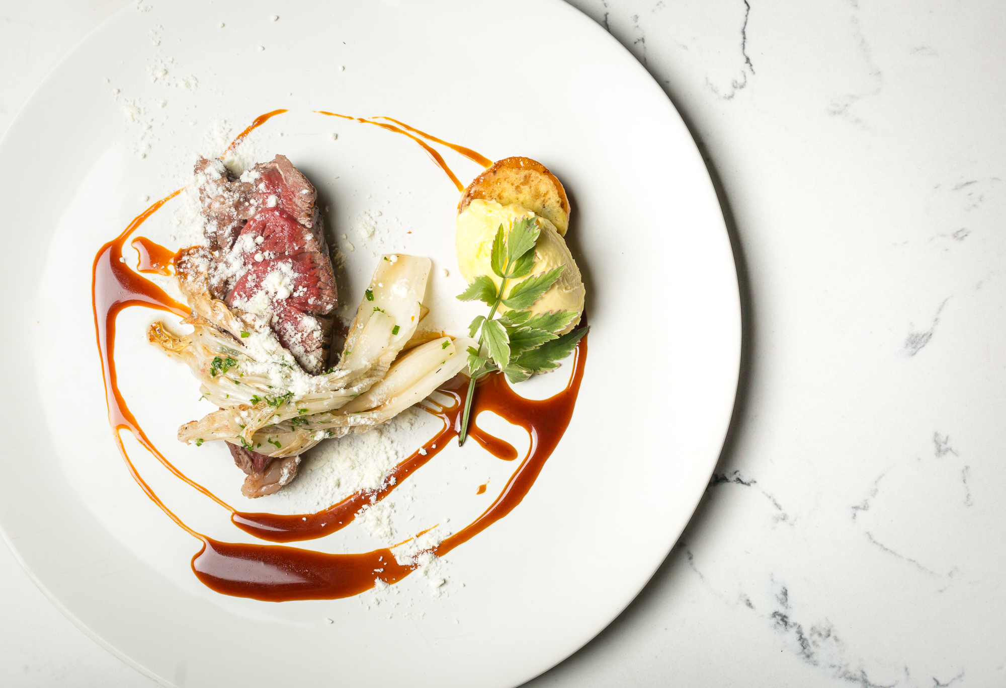 wagyu ribeye butter poach/egg butter/kimchi/pommes fondant/veal demi/white cheddar
