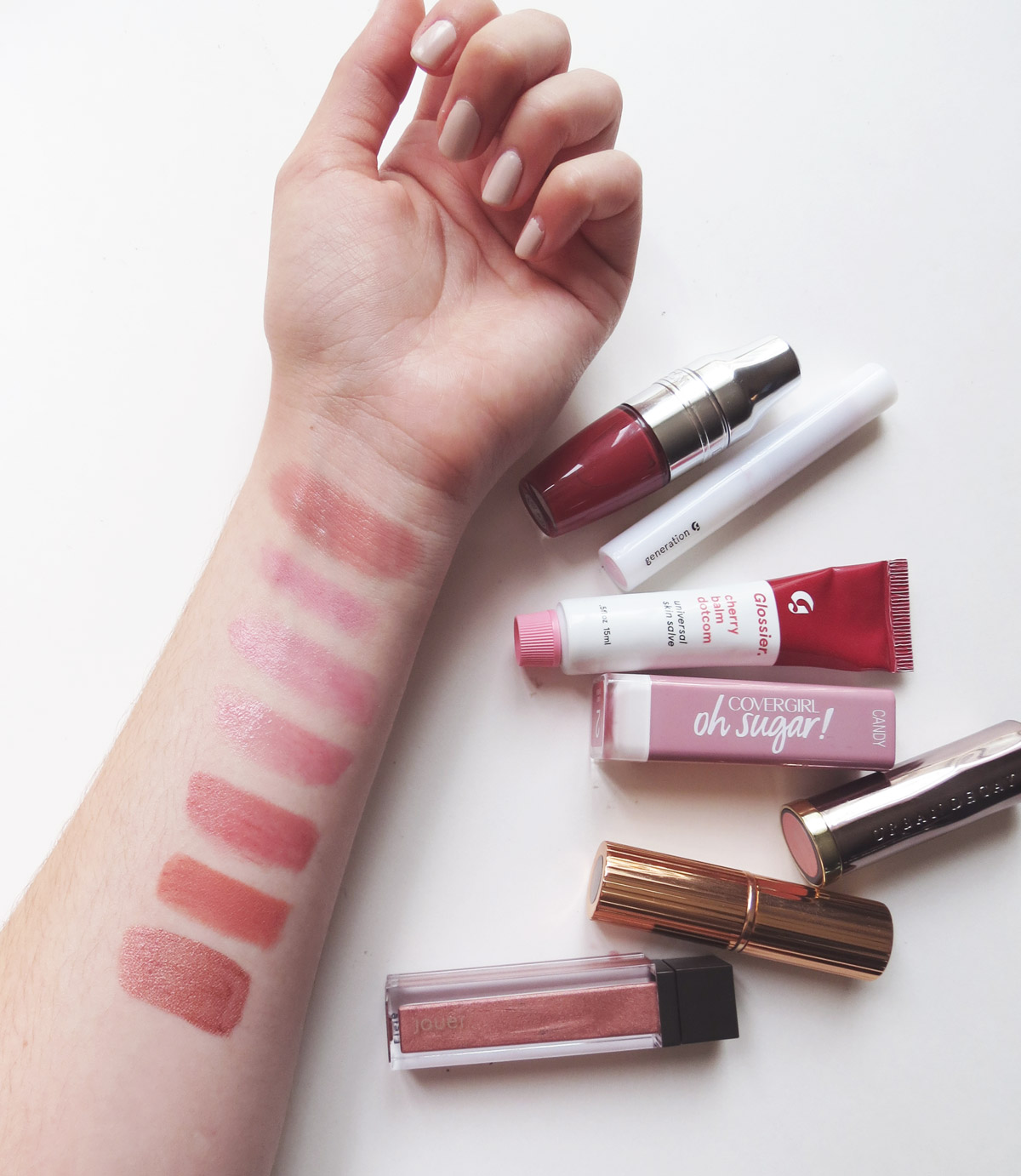 Top to Bottom: Lancome Vanilla Pop, Glossier Like, Glossier Cherry Balm Dotcom, Covergirl Candy, Urban Decay Sheer Liar, Charlotte Tilbury Super Cindy, Jouer Praline