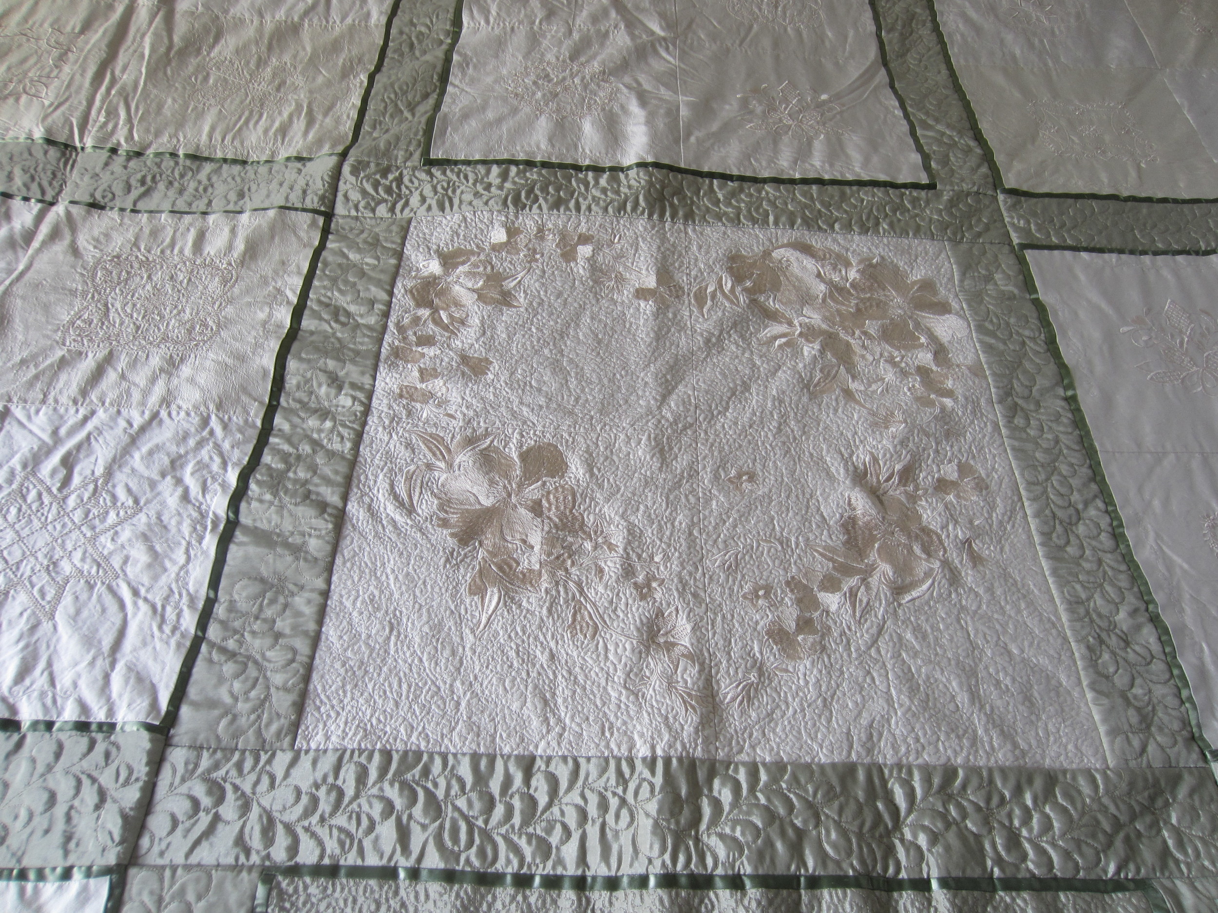 Embroidered and quilted silk duvet. King-size cost is $1,000.