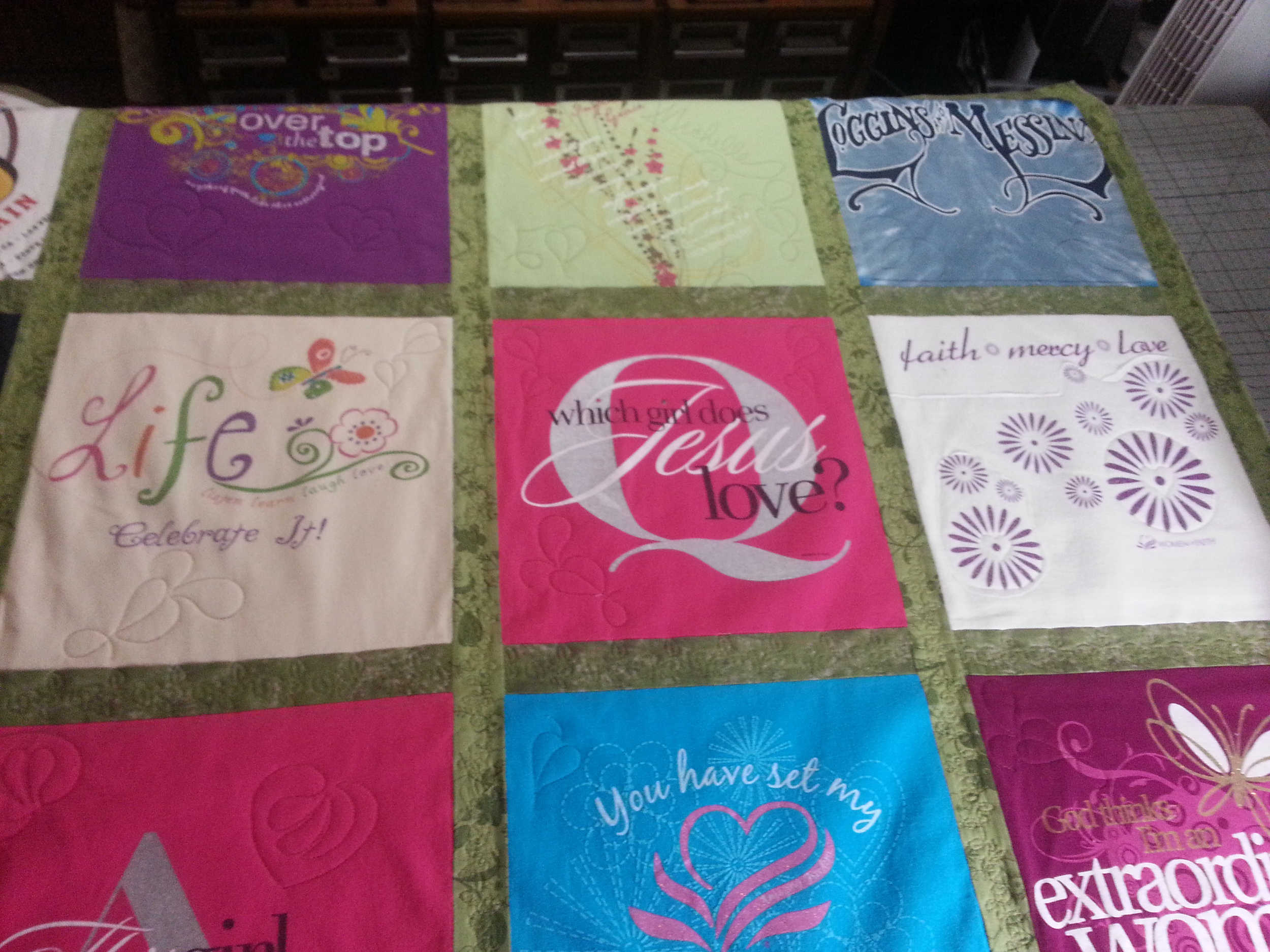 Lap-size T-Shirt quilt costs $150 complete. Postage/shipping not included.
