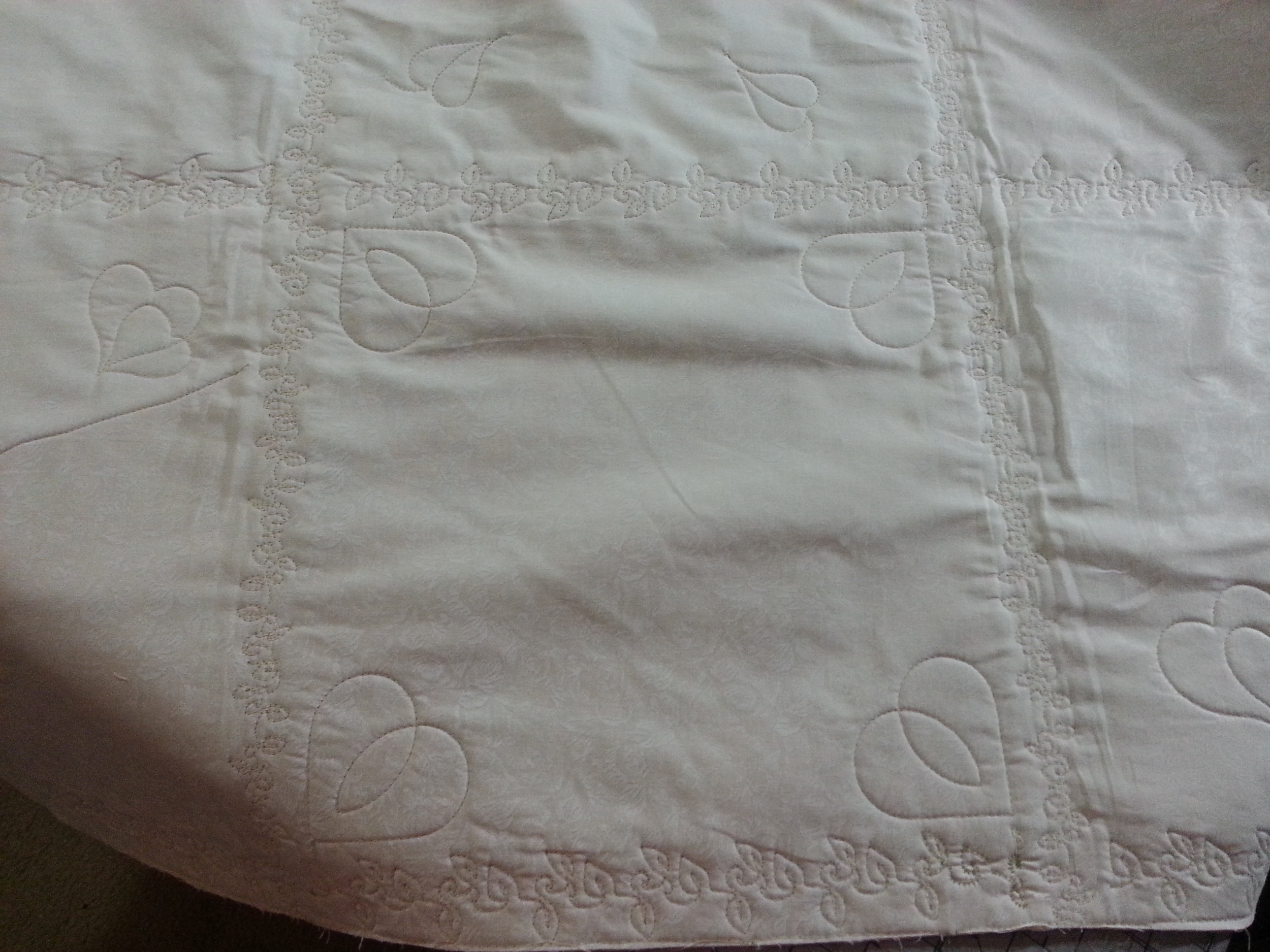 T-Shirt quilt quilted on the sashing and sparcely on the blocks.