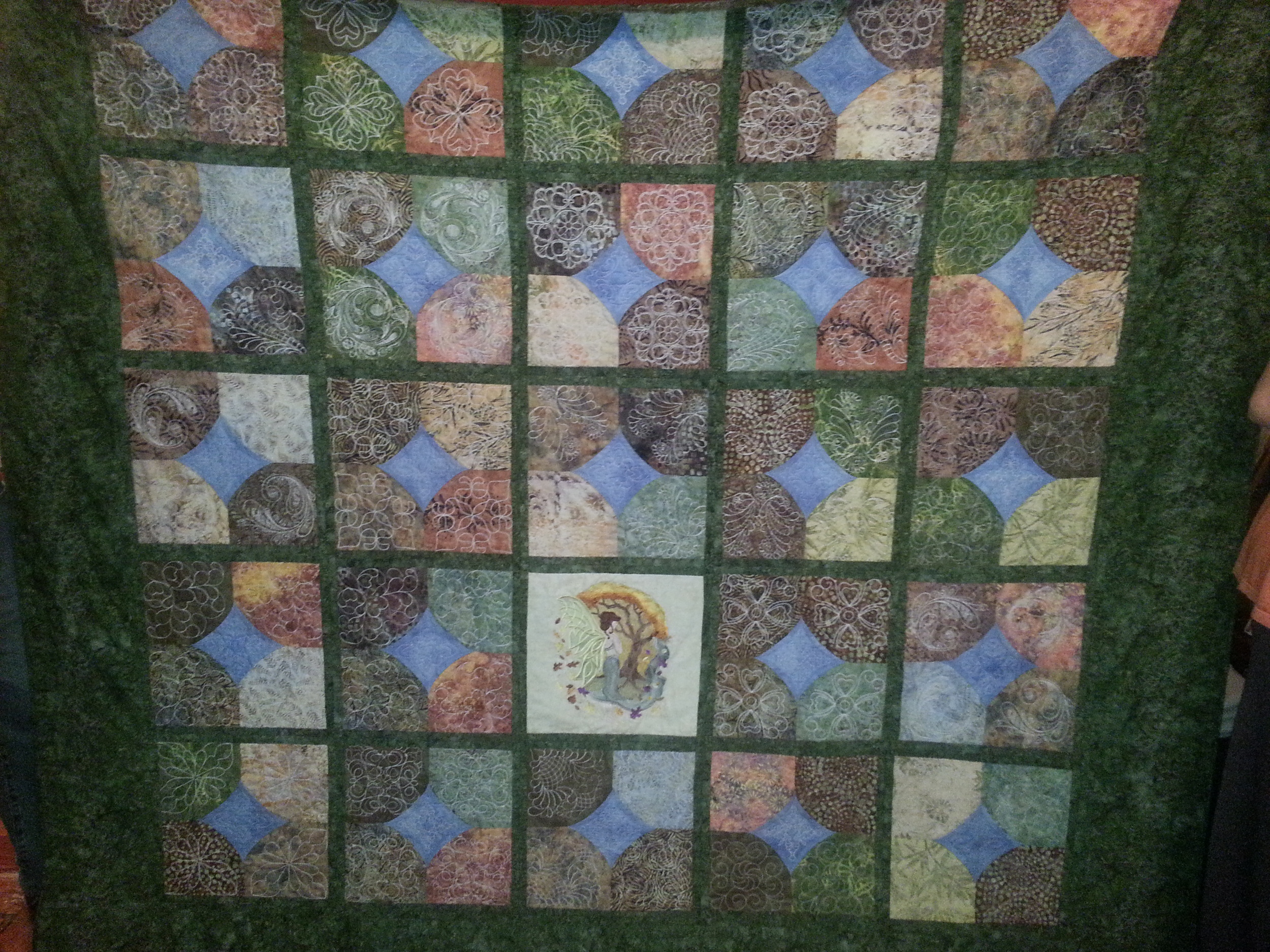 Reversible quilt with large center embroidery. Cost $600