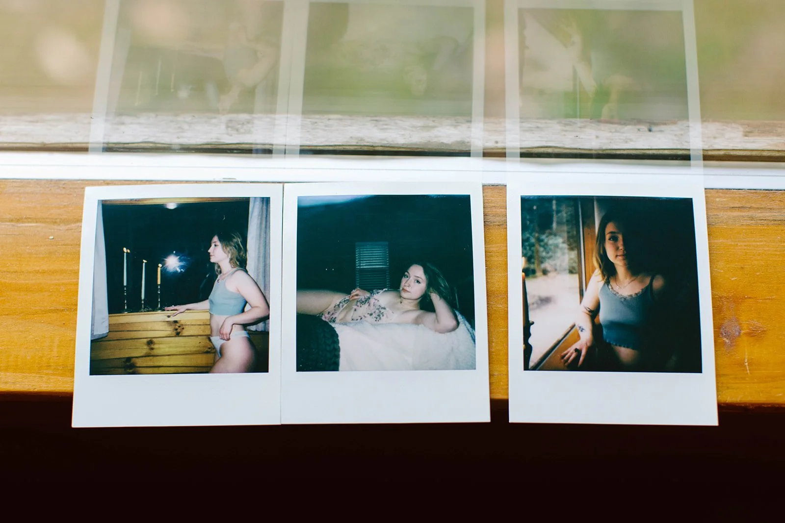 Three instant photos of a young woman, each in different settings: in front of a window, lying on a bed indoors, and standing by a window outdoors.