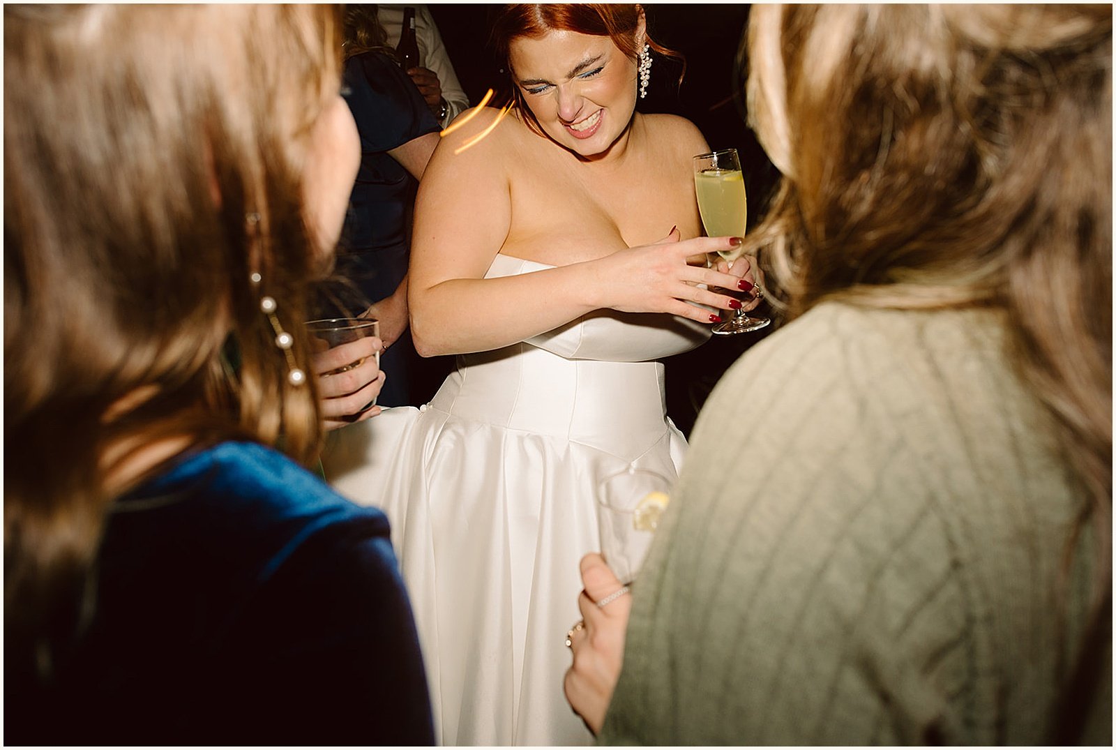 A bride dances with friends.