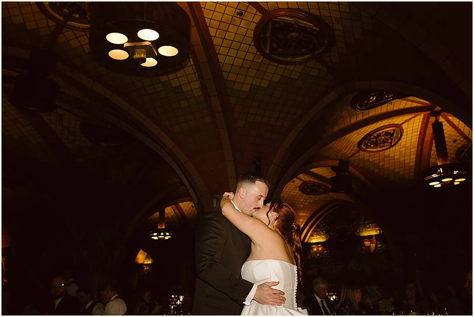 A bride and groom kiss during a wedding reception at the Seelbach Hotel.