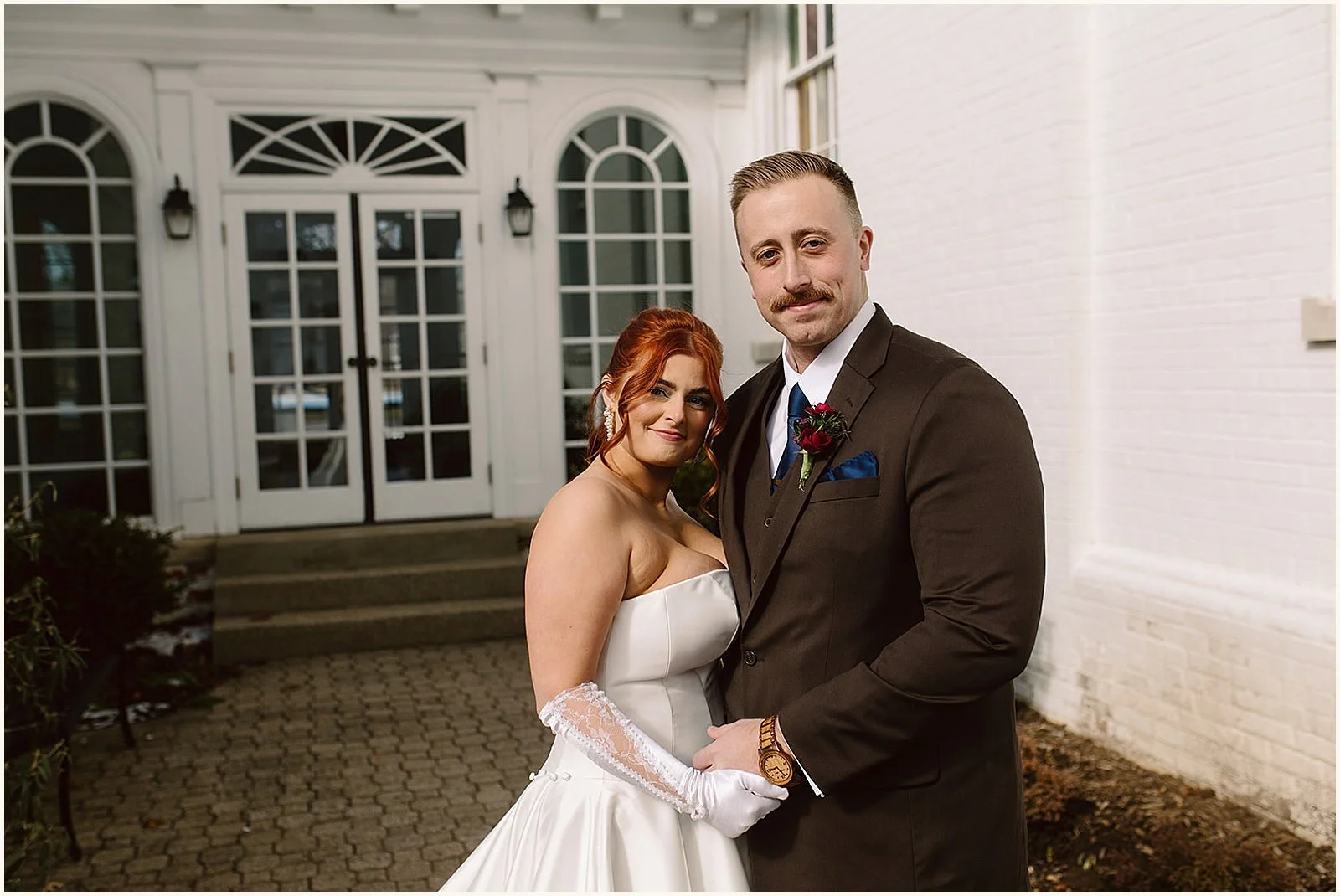 A bride and groom pose for a Louisville wedding photographer.