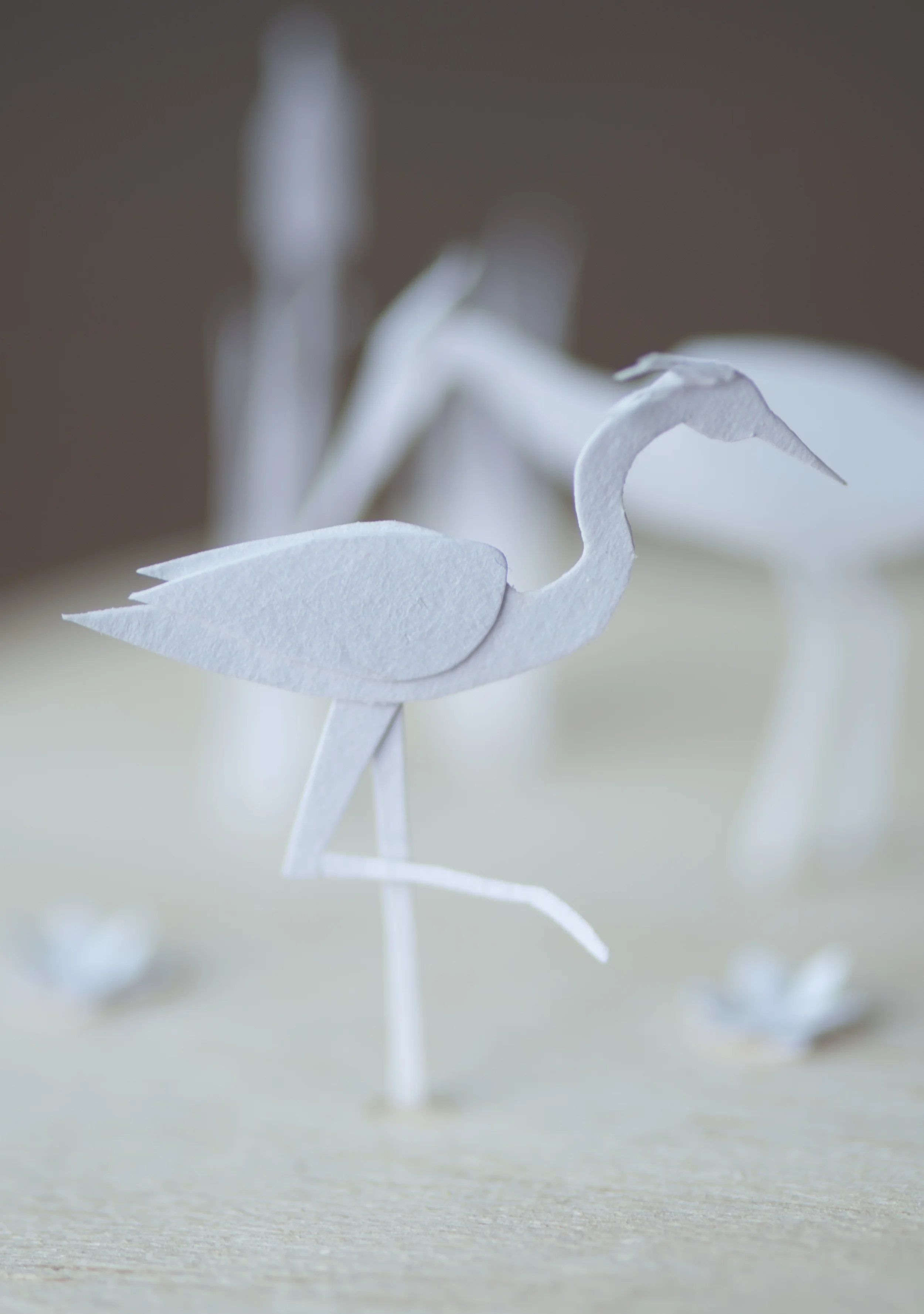 Hand cut paper, balsa wood base, glass dome (not shown) 3.5" dia, 5" high (Including glass dome)