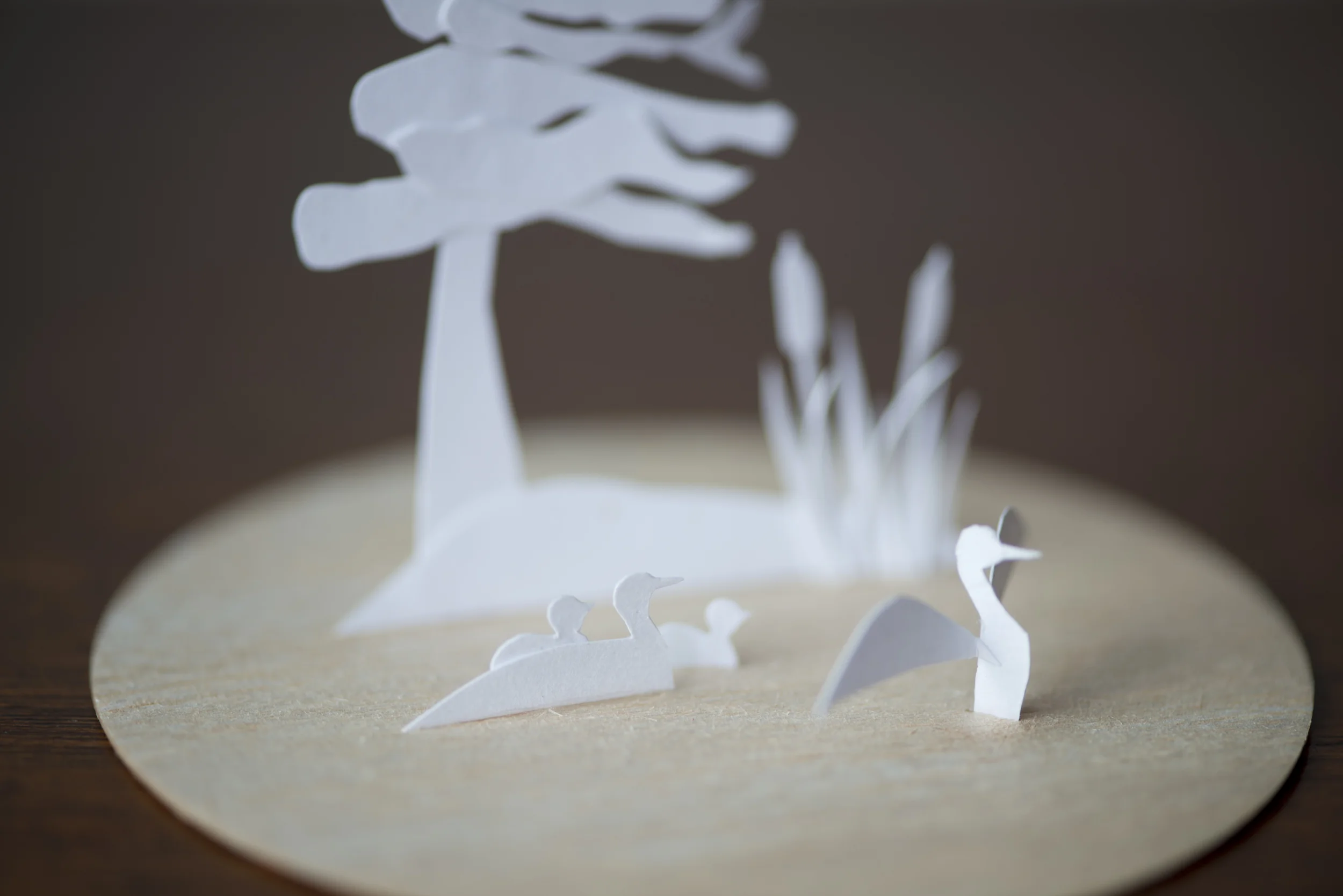 Hand cut paper, balsa wood base, glass dome (not shown) 3.5" dia, 5" high (Including glass dome)