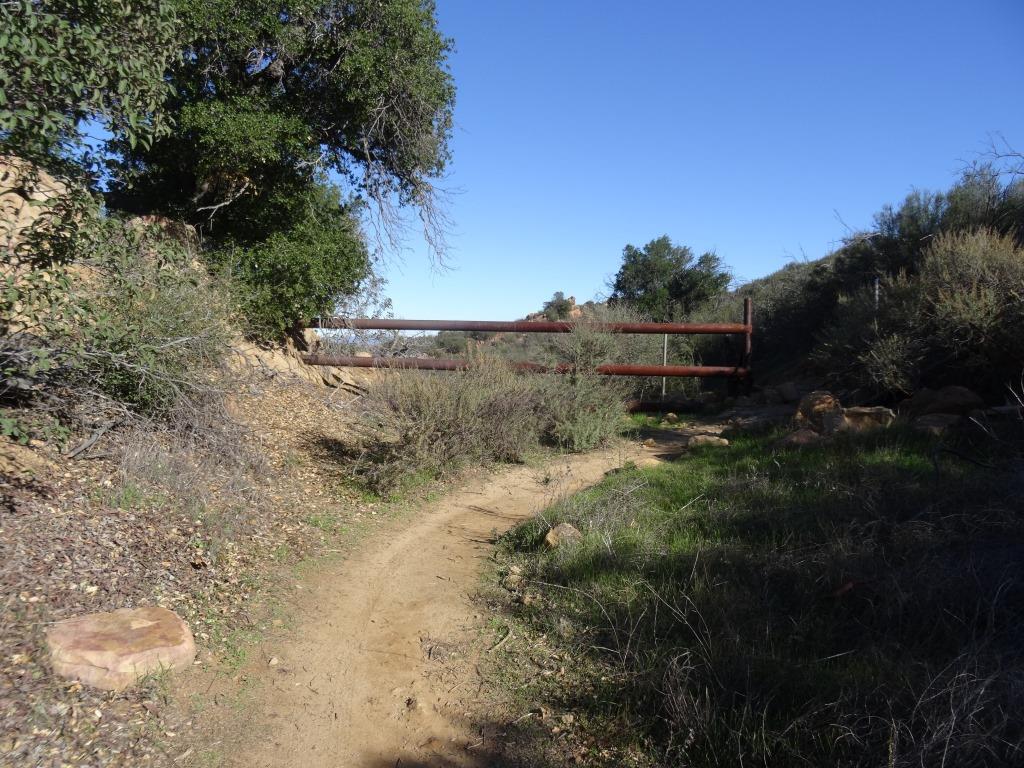 Here's a gate near to the top of the trail that tells you you are close to your destination.