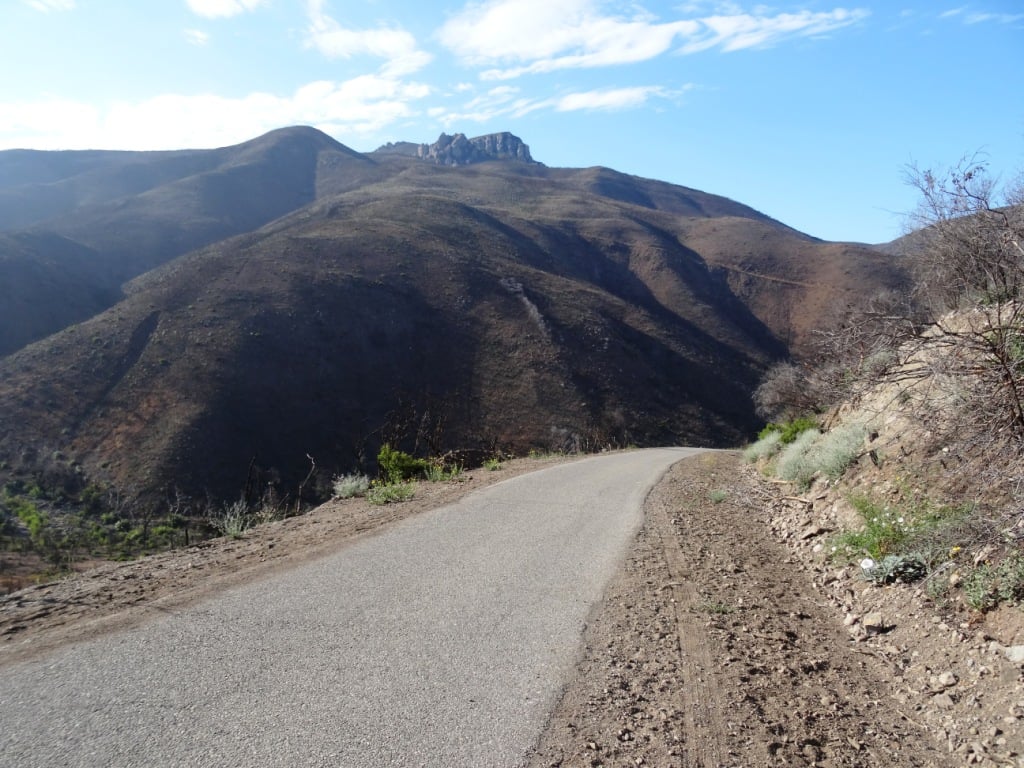 The descent down into the canyon on Big Sycamore Canyon Road is pretty steep. Watch for cyclists. Boney Mountain is seen in the distance.