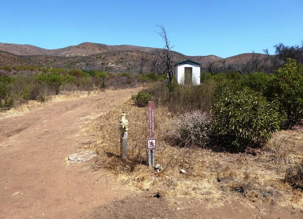 Here is where the La Jolla Valley Trail Campsites are, marked by the vault toilet up ahead. I don't get back here very often and when I do, I see no one. But I did notice there was TP in the room, which is good for those in need.