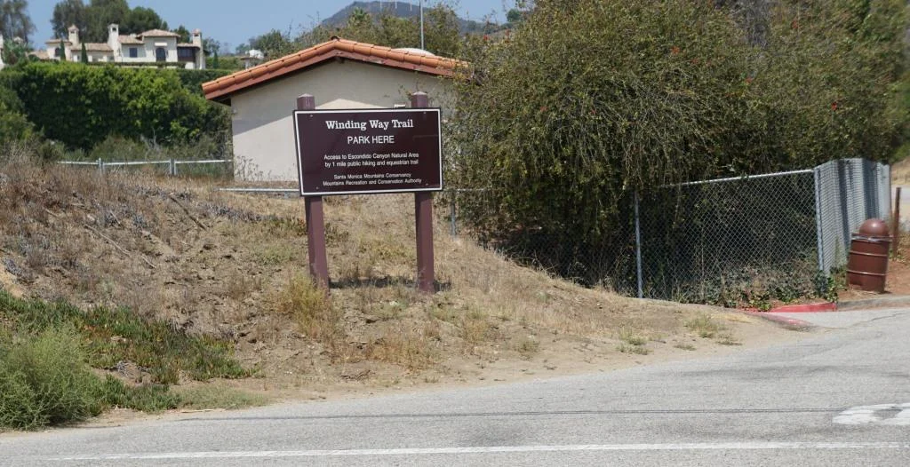The parking area is on Winding Way and PCH. The initial section of the hike is along Winding Way is called the Winding Way Trail.